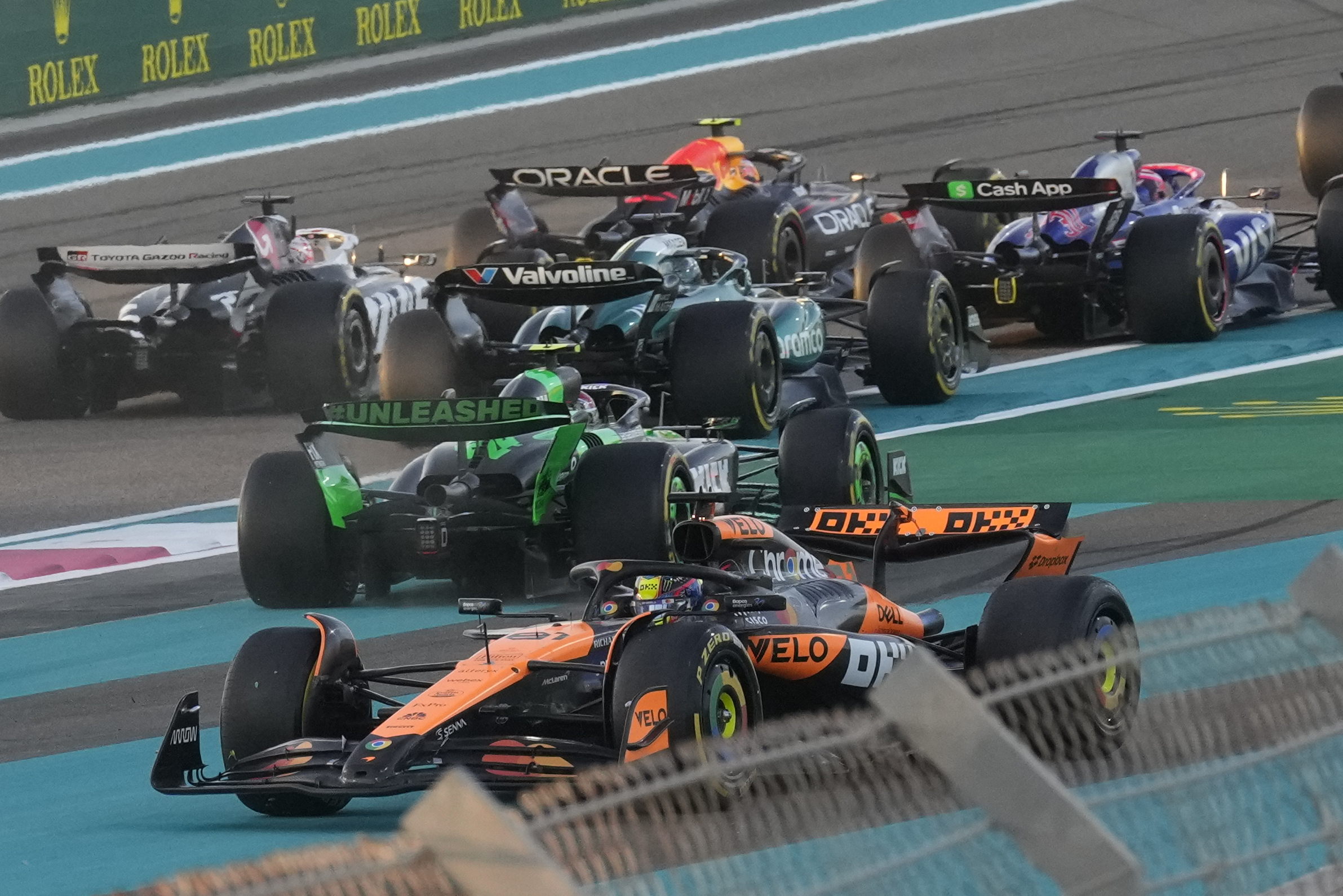 McLaren driver Oscar Piastri of Australia spins after contact with Red Bull driver Max Verstappen of the Netherlands in the first corner during the Formula One Abu Dhabi Grand Prix at the Yas Marina Circuit in Abu Dhabi, UAE, Sunday, Dec. 8, 2024. (AP Photo/Darko Bandic)