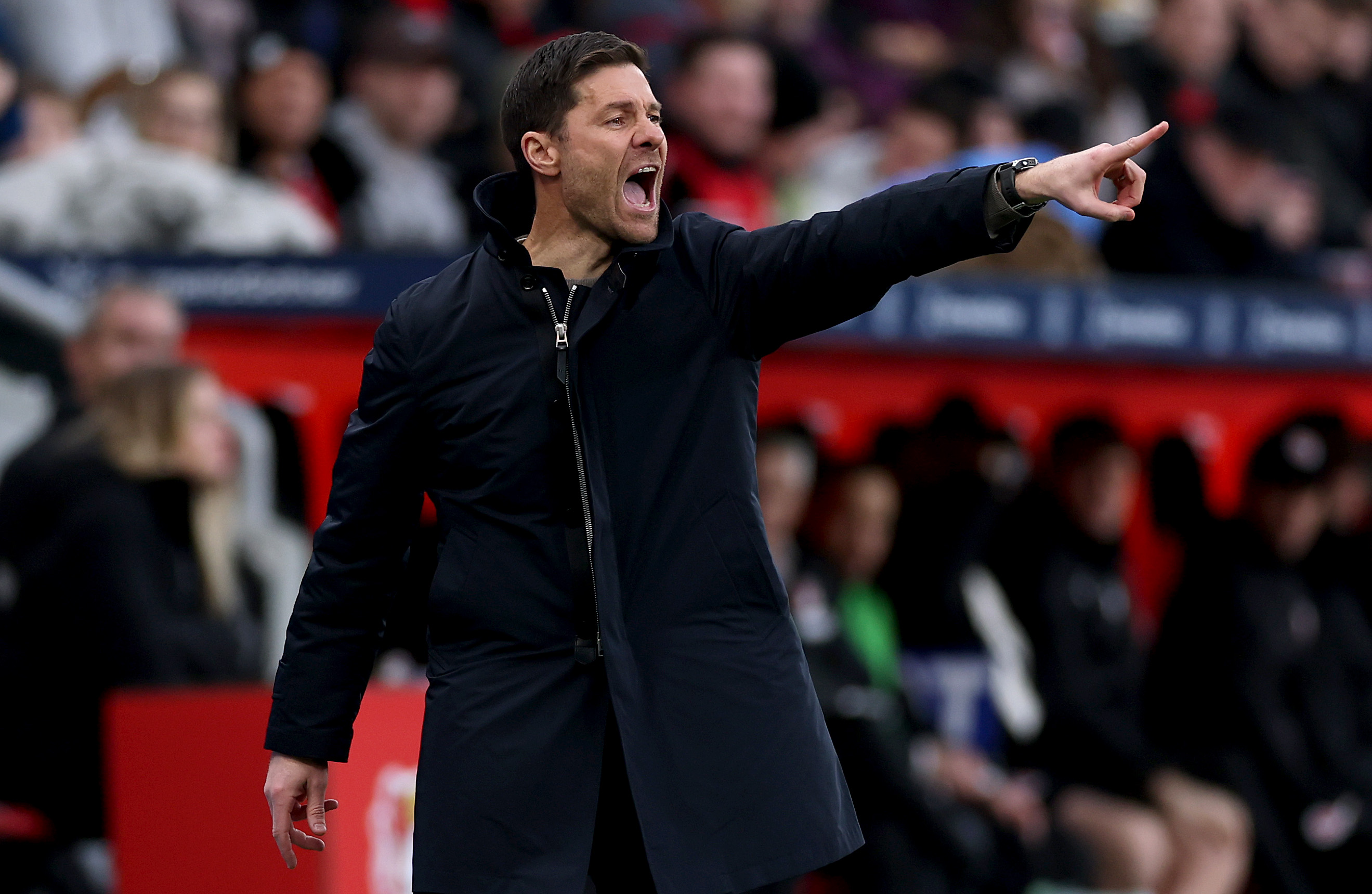 LEVERKUSEN, GERMANY - DECEMBER 07: Xabi Alonso, Head Coach of Bayer 04 Leverkusen, reacts during the Bundesliga match between Bayer 04 Leverkusen and FC St. Pauli 1910 at BayArena on December 07, 2024 in Leverkusen, Germany. (Photo by Lars Baron/Getty Images)