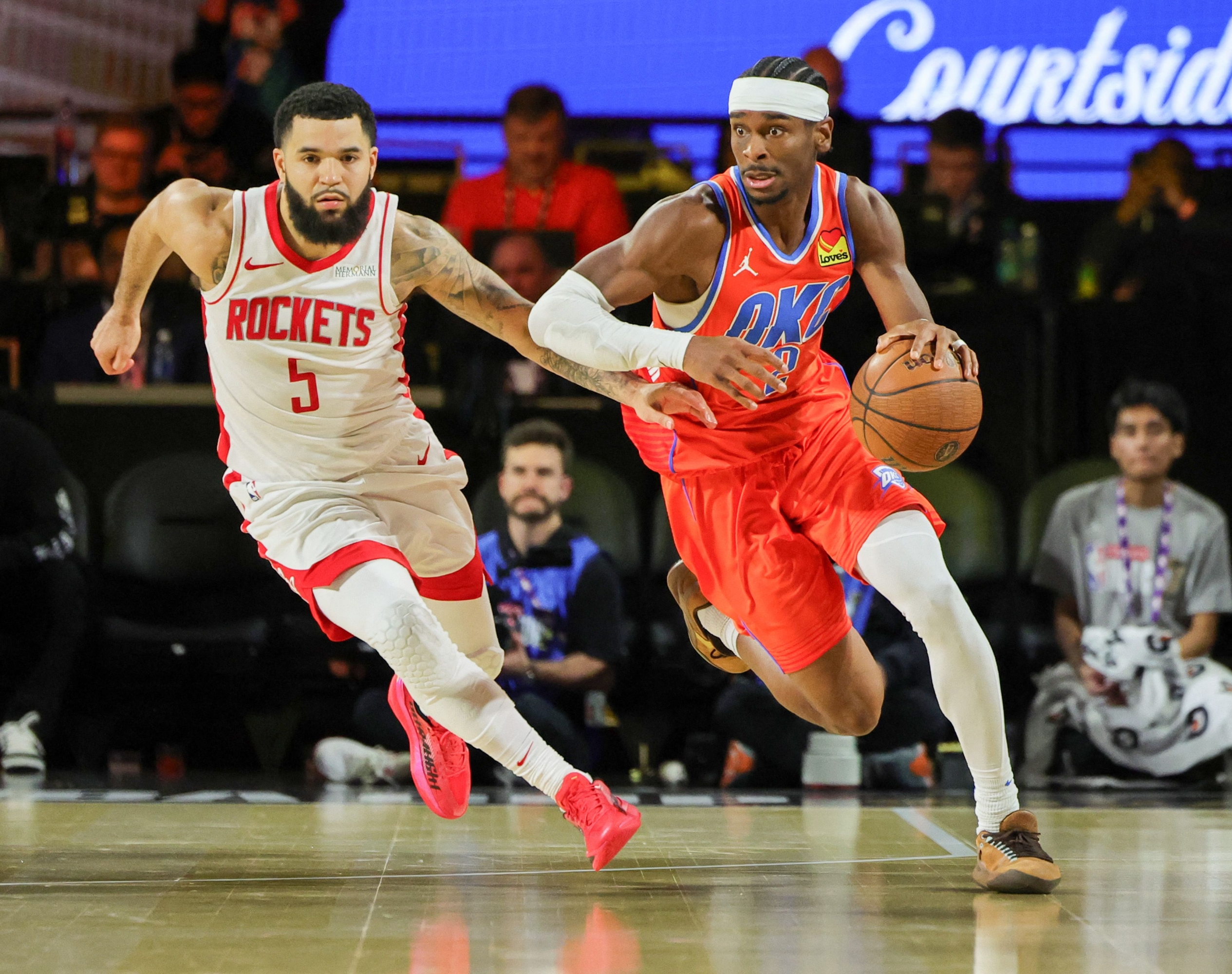 LAS VEGAS, NEVADA - DECEMBER 14: Shai Gilgeous-Alexander #2 of the Oklahoma City Thunder brings the ball up the court against Fred VanVleet #5 of the Houston Rockets in the second half of a semifinal game of the Emirates NBA Cup at T-Mobile Arena on December 14, 2024 in Las Vegas, Nevada. The Thunder defeated the Rockets 111-96. NOTE TO USER: User expressly acknowledges and agrees that, by downloading and or using this photograph, User is consenting to the terms and conditions of the Getty Images License Agreement.   Ethan Miller/Getty Images/AFP (Photo by Ethan Miller / GETTY IMAGES NORTH AMERICA / Getty Images via AFP)