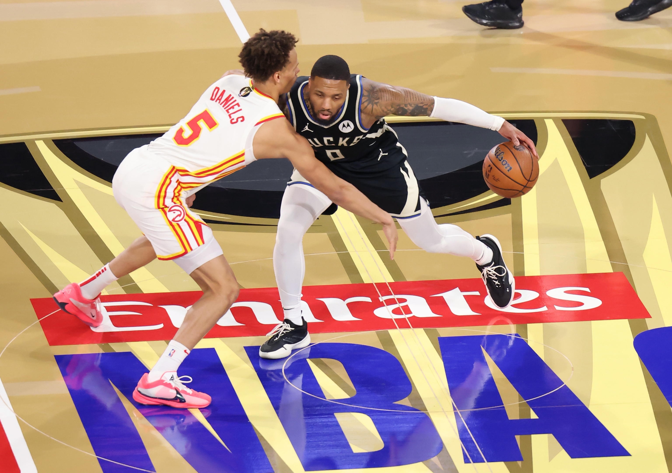 epa11777890 Milwaukee Bucks guard Damian Lillard (0) defends the ball from Atlanta Hawks guard Dyson Daniels (5) at center court during the first half of the semi-final game between the Atlanta Hawks and the Milwaukee Bucks in the 2024 NBA Cup in-season tournament in Las Vegas, Nevada, USA, 14 December 2024. EPA/RONDA CHURCHILL SHUTTERSTOCK OUT