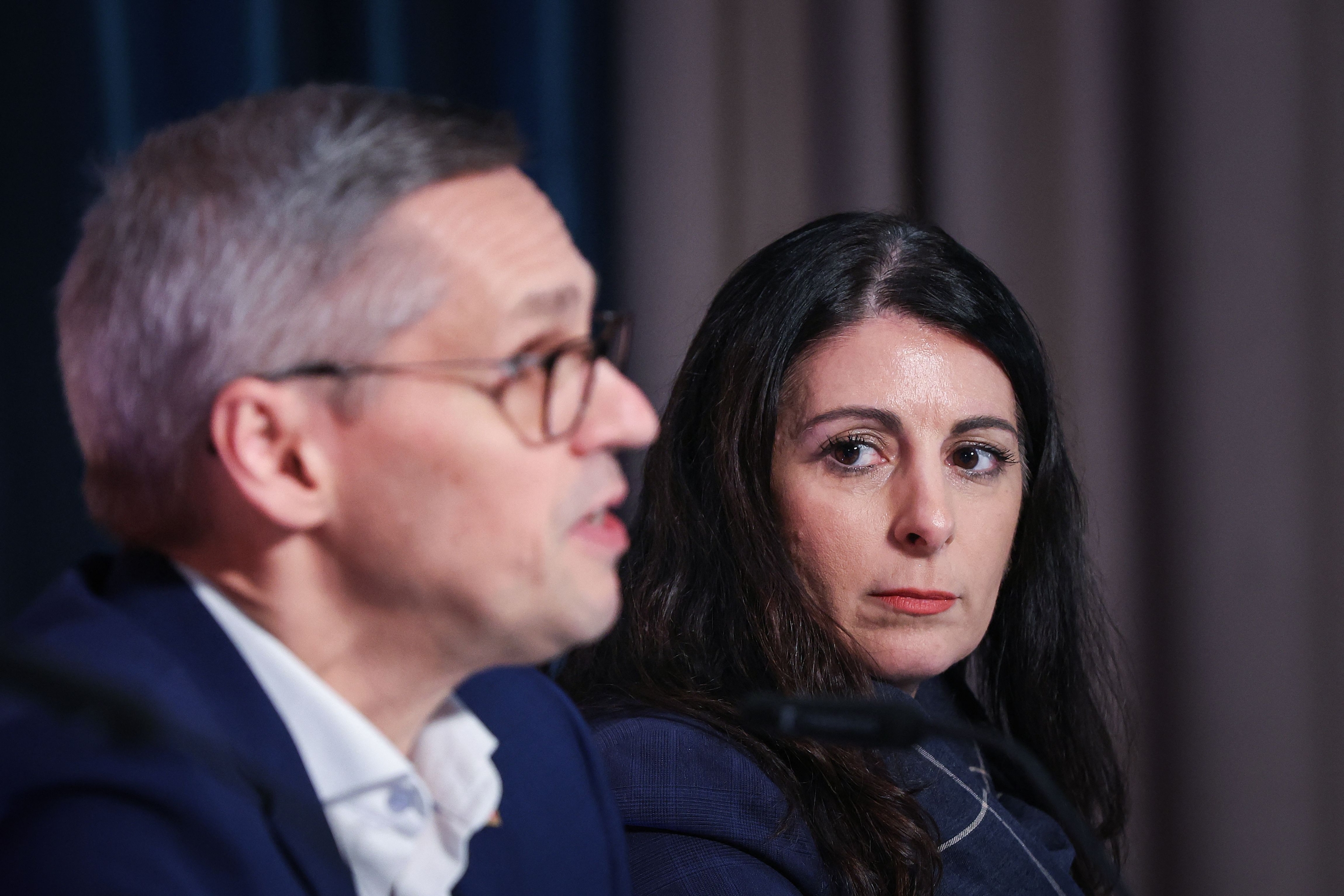 Negotiator of the IG Metall metalworkers union Thorsten Groeger and chairwoman of the General and Group Works Council of the Volkswagen Group Daniela Cavallo hold a joint press conference following marathon talks with Europe's largest German car manufacturer Volkswagen (VW) on December 20, 2024 in Hanover, northern Germany. The German union IG Metall said on December 20, 2024 it had reached an agreement with Volkswagen on a cost-cutting plan that would avoid forced redundancies at Europe's largest carmaker's production sites in Germany. (Photo by Ronny HARTMANN / AFP)