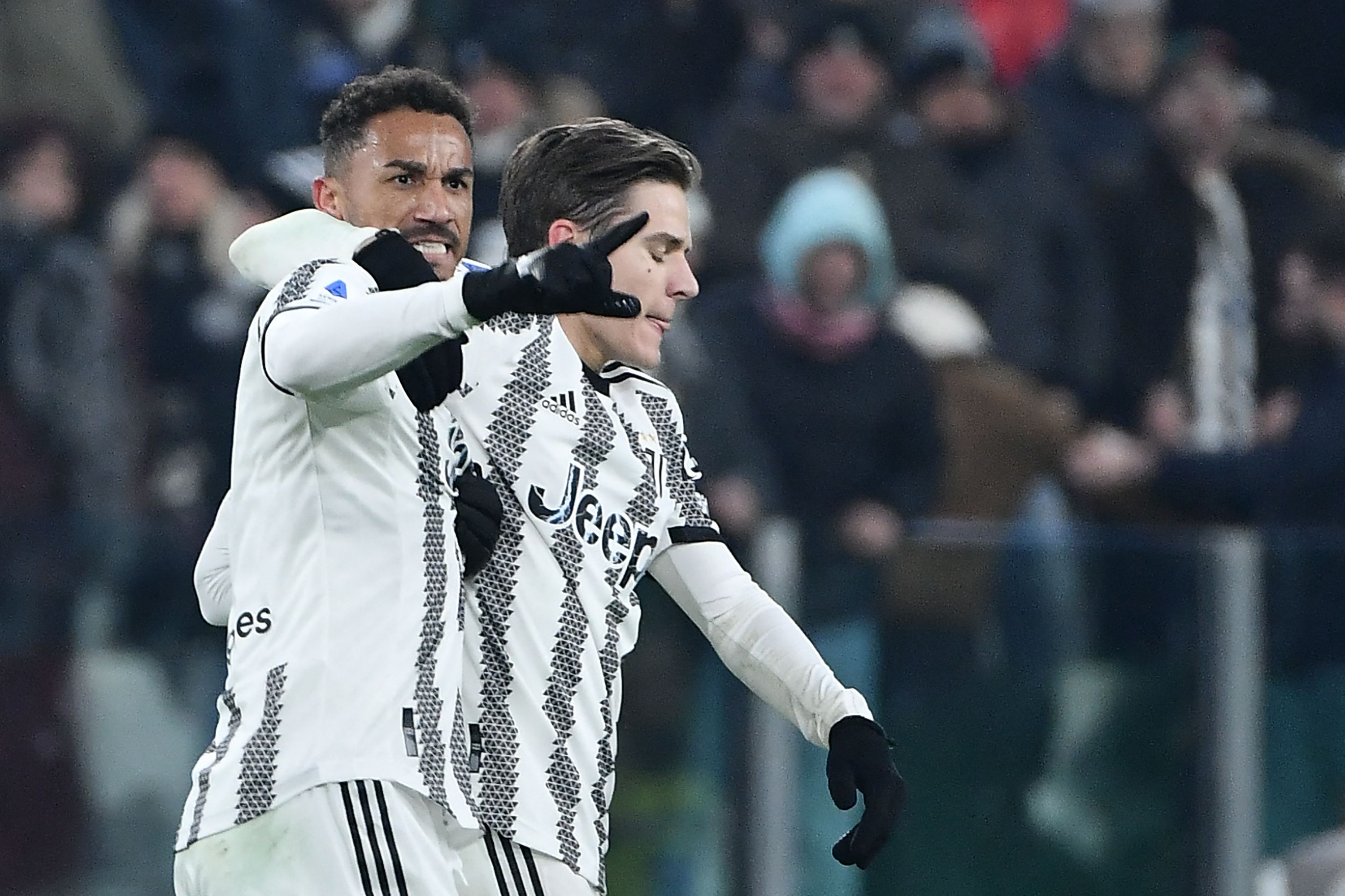 Juventus' Brazilian defender Danilo (L) celebrates with Juventus' Italian midfielder Nicolo Fagioli after scoring his team's third goal during the Italian Serie A football match between Juventus and Atalanta at the Juventus Stadium in Turin, on January 22, 2023. (Photo by Isabella BONOTTO / AFP)