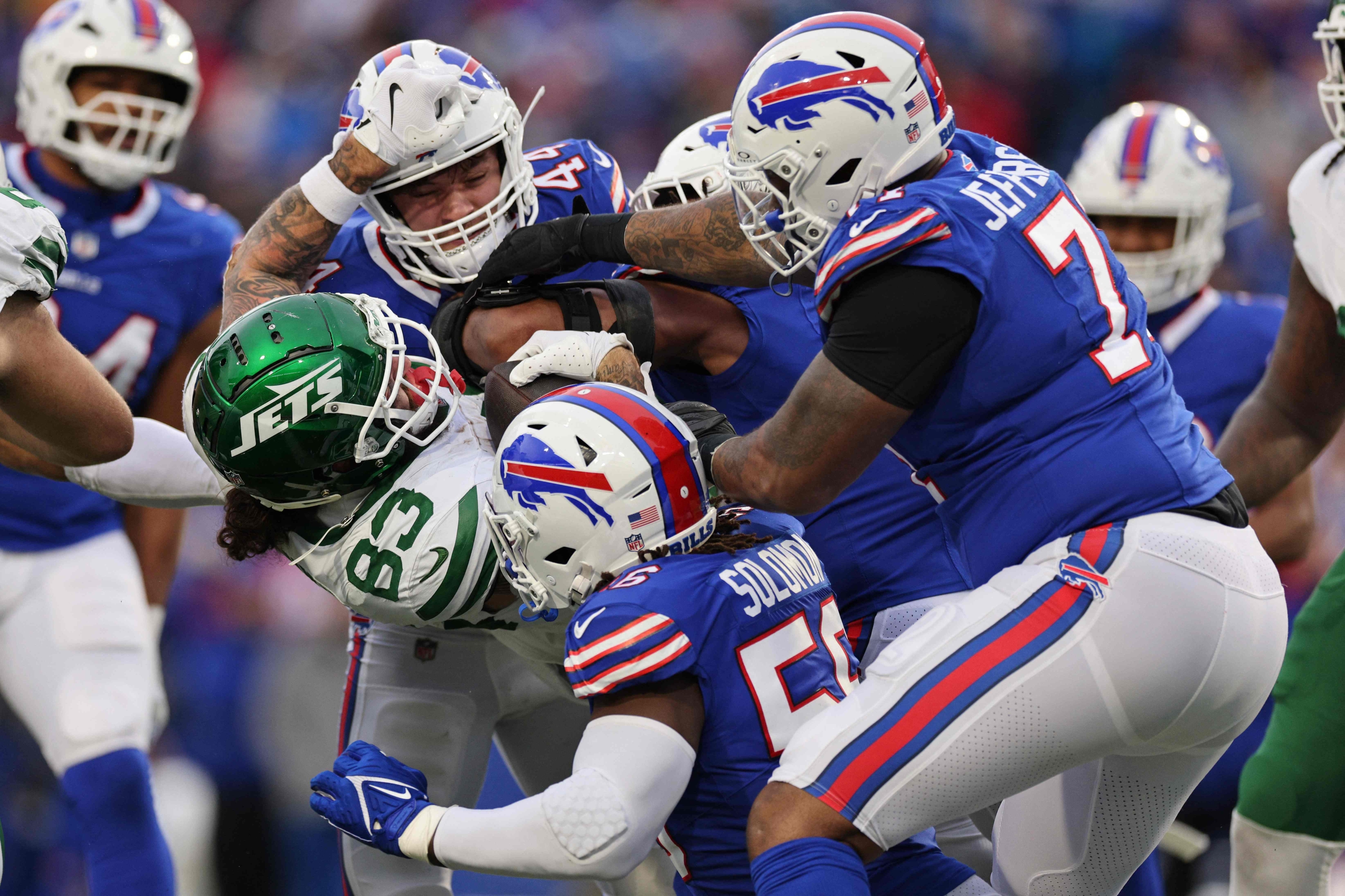 ORCHARD PARK, NEW YORK - DECEMBER 29: Tyler Conklin #83 of the New York Jets is tackled in the fourth quarter of a game against the Buffalo Bills at Highmark Stadium on December 29, 2024 in Orchard Park, New York.   Bryan M. Bennett/Getty Images/AFP (Photo by Bryan M. Bennett / GETTY IMAGES NORTH AMERICA / Getty Images via AFP)