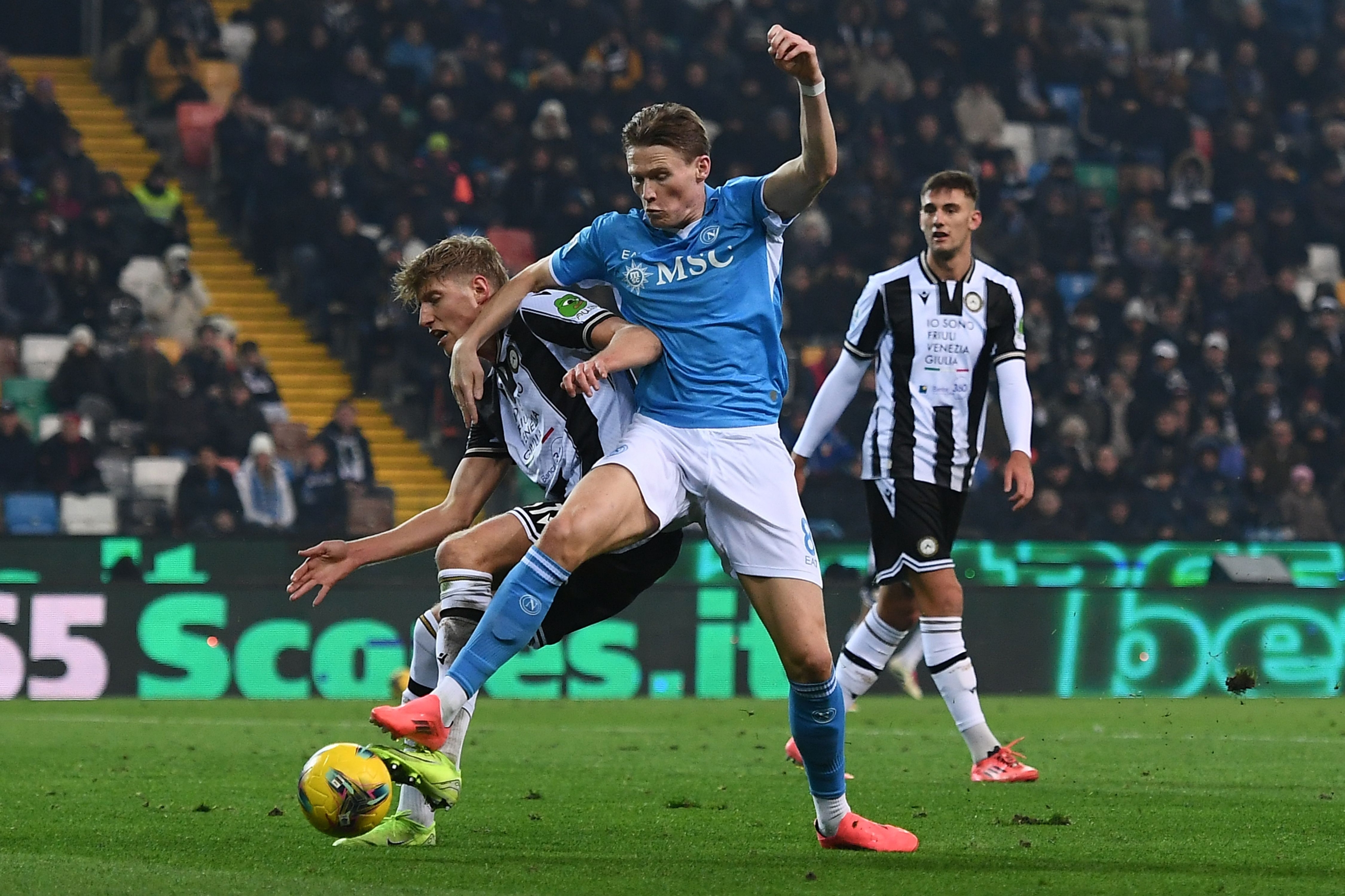 UDINE, ITALY - DECEMBER 14:  Thomas Kristensen of Udinese Calcio competes for the ball with Scott McTominay of Napoli during the Serie A match between Udinese and Napoli at Stadio Friuli on December 14, 2024 in Udine, Italy. (Photo by Alessandro Sabattini/Getty Images)