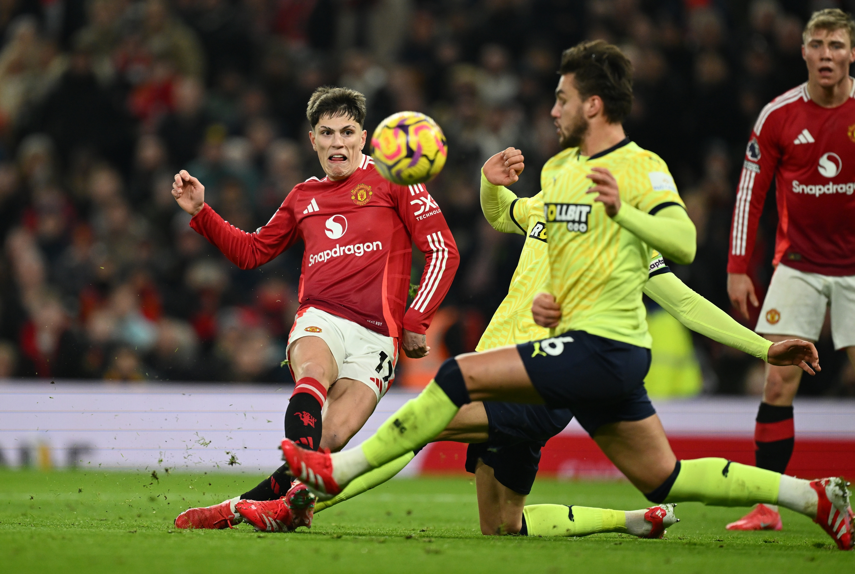 Alejandro Garnacho of Manchester United shoots the ball whilst under pressure from Taylor Harwood-Bellis of Southampton during the Premier League match between Manchester United FC and Southampton FC at Old Trafford on January 16, 2025 in Manchester, England. (Photo by Gareth Copley/Getty Images)