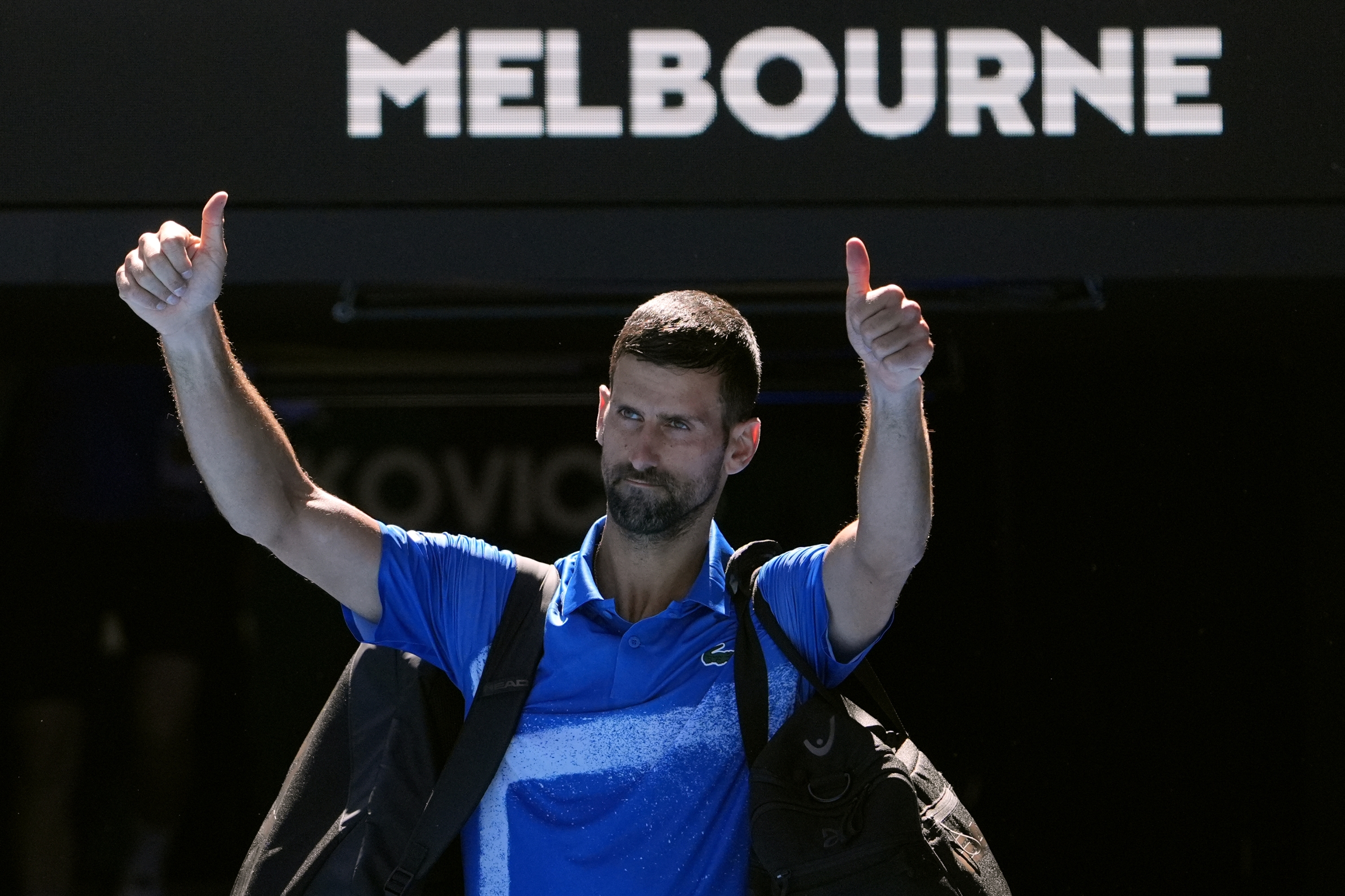 Novak Djokovic of Serbia gestures as he leaves Rod Laver Arena after retiring in his semifinal match against against Alexander Zverev of Germany at the Australian Open tennis championship in Melbourne, Australia, Friday, Jan. 24, 2025. (AP Photo/Asanka Brendon Ratnayake)