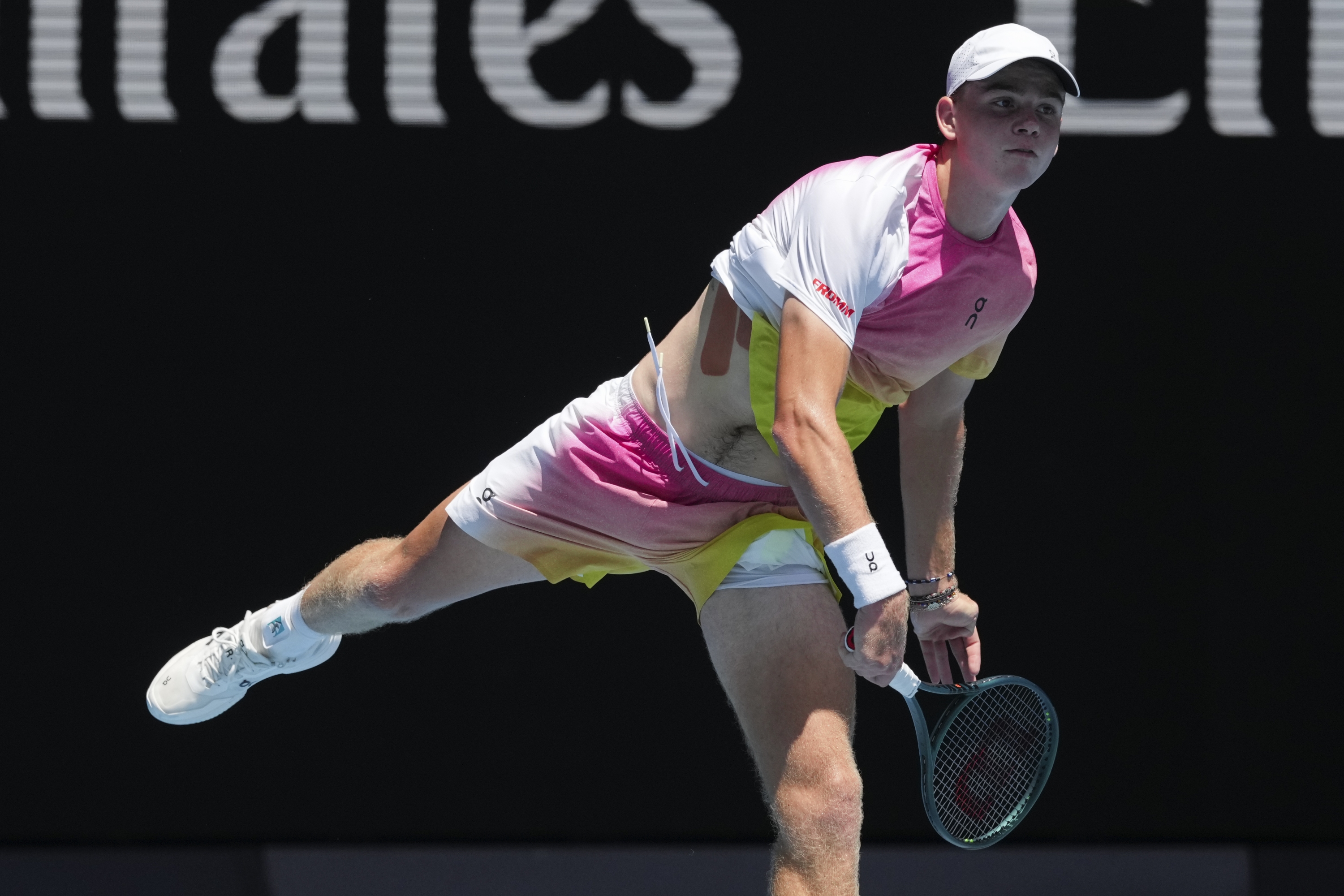 Henry Bernet of Switzerland serves to Benjamin Willwerth of the U.S. during the boy's singles final at the Australian Open tennis championship in Melbourne, Australia, Saturday, Jan. 25, 2025. (AP Photo/Mark Baker)