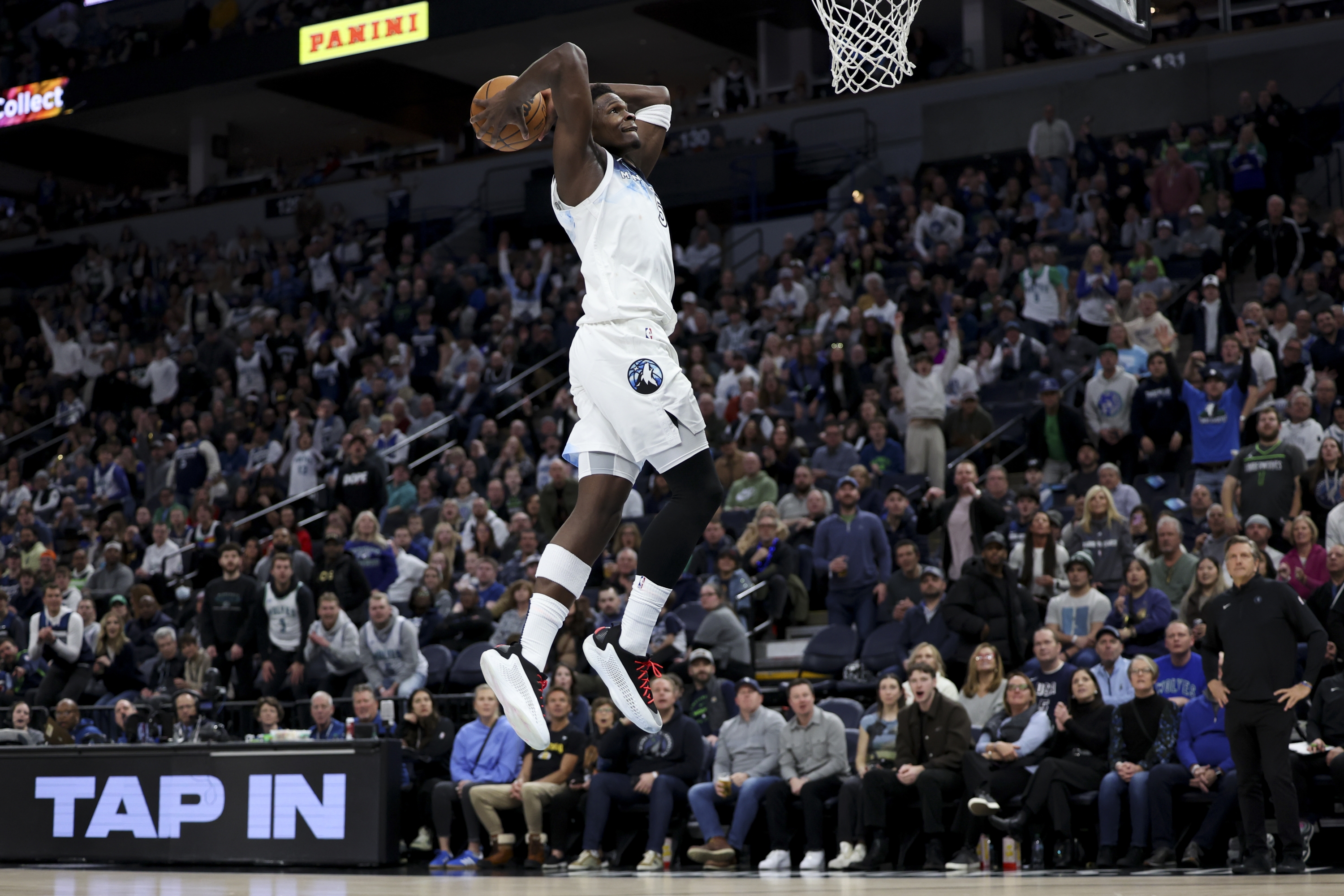 Minnesota Timberwolves guard Anthony Edwards (5) prepares to dunk during the first half of an NBA basketball game against the Denver Nuggets, Saturday, Jan. 25, 2025, in Minneapolis. (AP Photo/Ellen Schmidt)