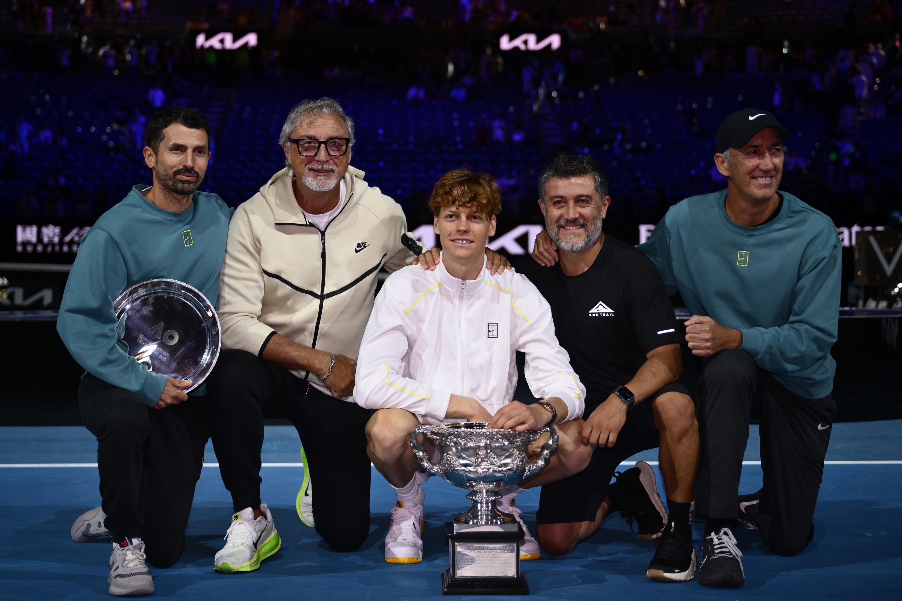 MELBOURNE, AUSTRALIA - JANUARY 26: Jannik Sinner of Italy  poses with his coaching staffs including Simone Vagnozzi and Darren Cahill after the Men's Singles trophy presentation following the Men's Singles final against Alexander Zverev of Germany during day 15 of the 2025 Australian Open at Melbourne Park on January 26, 2025 in Melbourne, Australia. (Photo by Quinn Rooney/Getty Images)