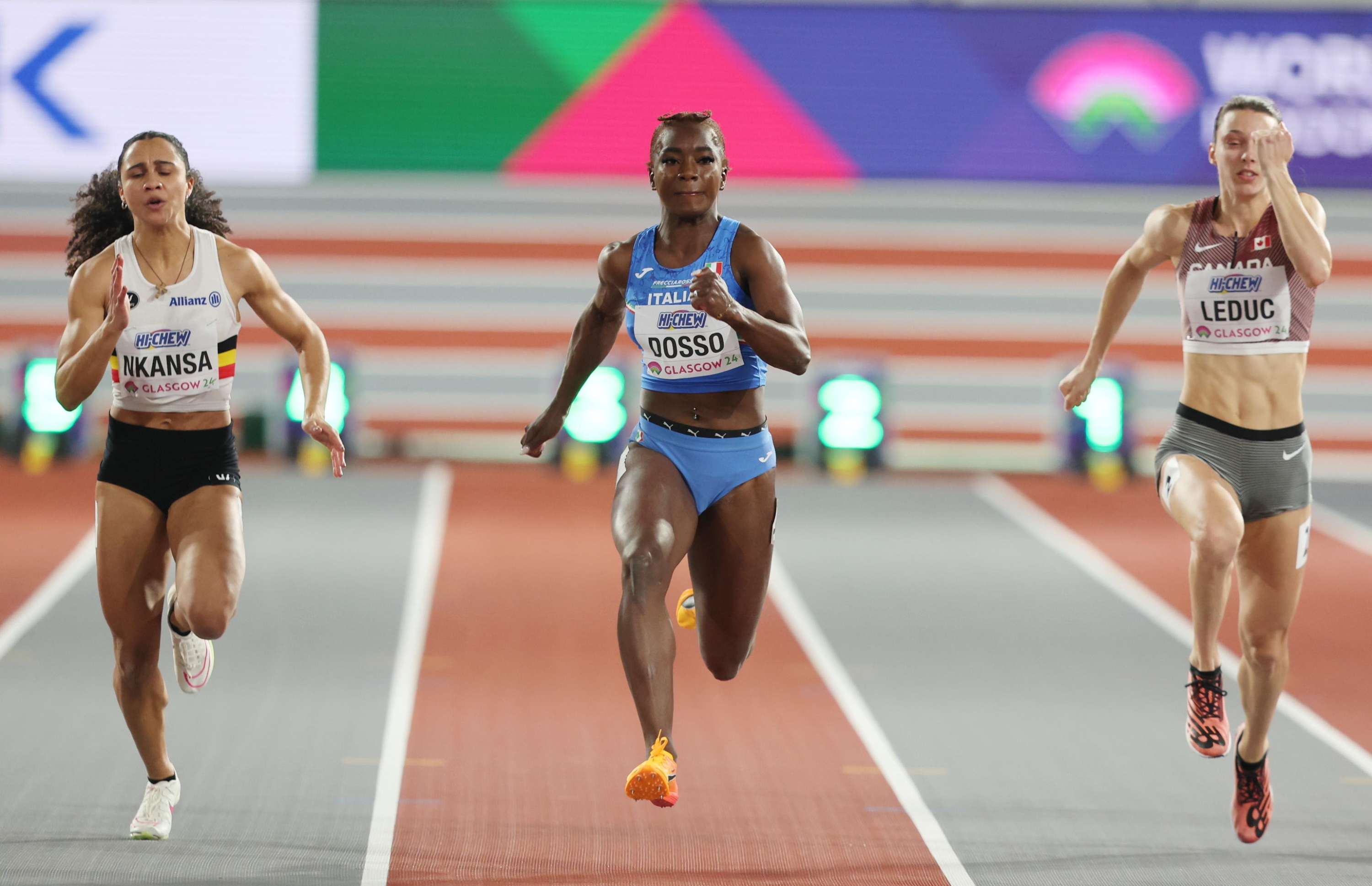 epa11193467 (L-R) Delphine Nkansa of Belgium, Zaynab Dosso of Italy, and Audrey Leduc of Canada  compete in a Women???s 60m heat at the World Athletics Indoor Championships in Glasgow, Britain, 02 March 2024.  EPA/ROBERT PERRY