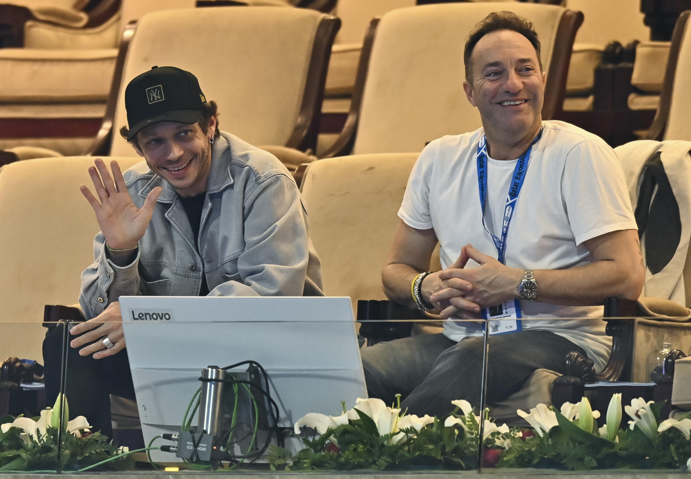 epa11911528 MotoGP rider Valentino Rossi (L) in the stands during the quarterfinal match between Matteo Berrettini of Italy and Jack Draper of Britain at the ATP Qatar Open tennis tournament in Doha, Qatar, 20 February 2025.  EPA/NOUSHAD THEKKAYIL