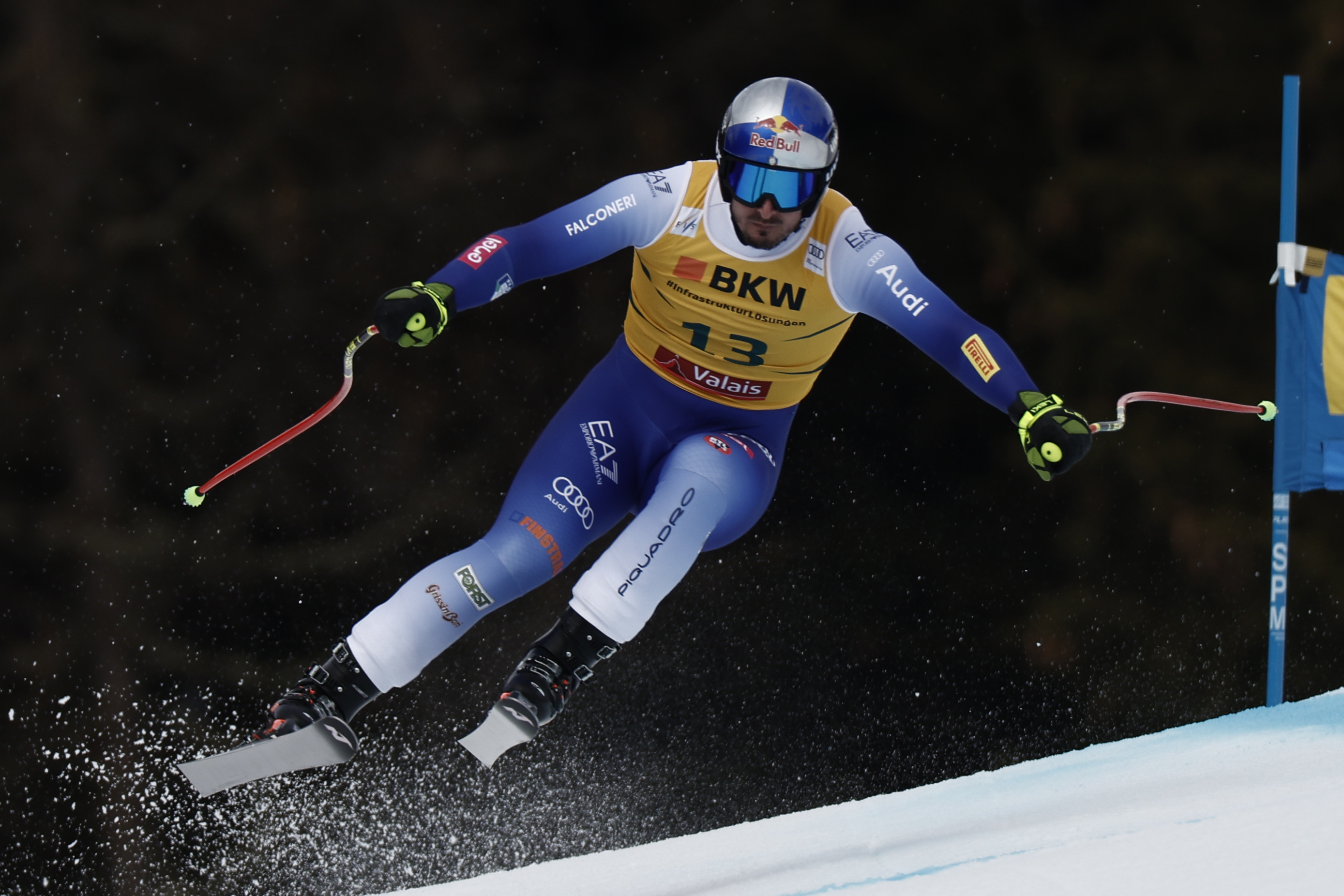 Italy's Dominik Paris speeds down the course during an alpine ski, men's World Cup super G, in Crans Montana, Switzerland, Sunday, Feb. 23 2025. (AP Photo/Gabriele Facciotti)