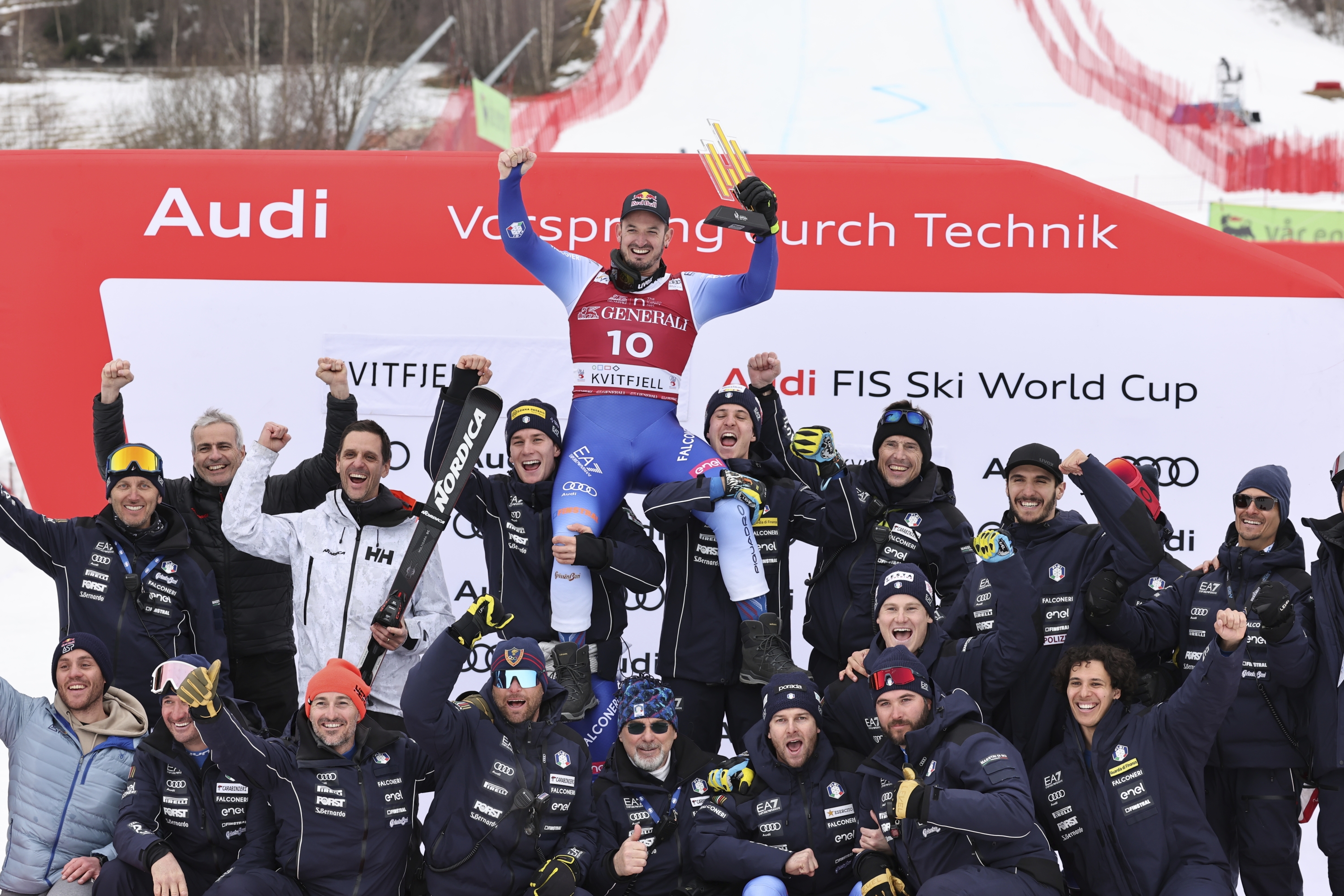 The winner Italy's Dominik Paris celebrates with the team after an alpine ski, men's World Cup downhill, in Kvitfjell, Norway, Saturday, March 8, 2025. (AP Photo/Marco Trovati)