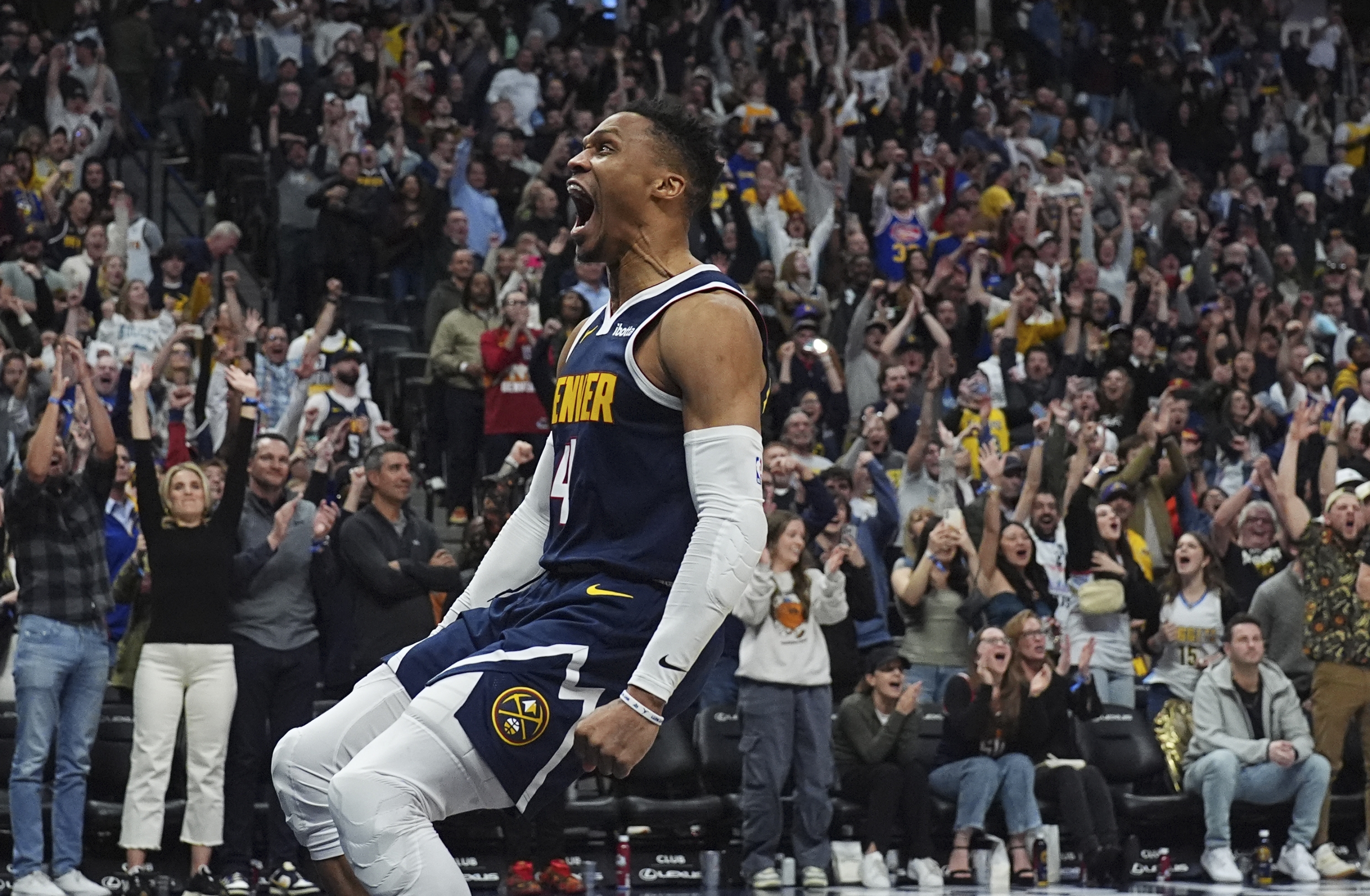 Denver Nuggets guard Russell Westbrook reacts after dunking for a basket late in the second half of an NBA basketball game against the Los Angeles Lakers, Friday, March 14, 2025, in Denver. (AP Photo/David Zalubowski)