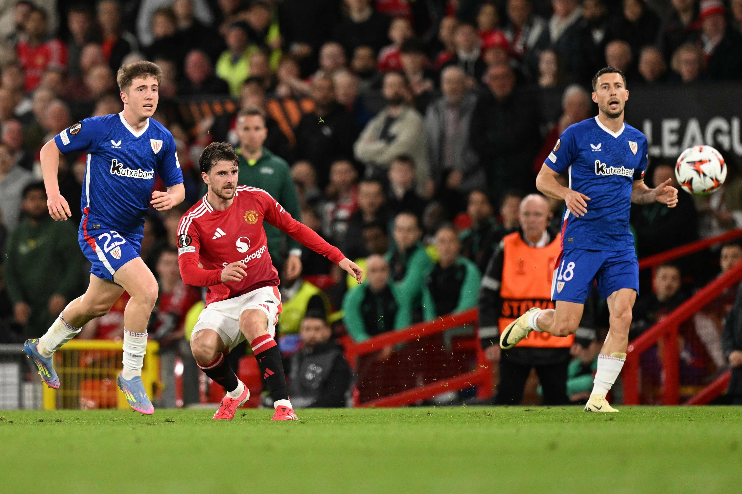 Manchester United's English midfielder #07 Mason Mount (C) watches his shot fly towards goal to score Manchester United's fourth goal during the UEFA Europa League semi final second leg football match between Manchester United and Athletic Club Bilbao at Old Trafford stadium in Manchester, north west England, on May 8, 2025. (Photo by Oli SCARFF / AFP)