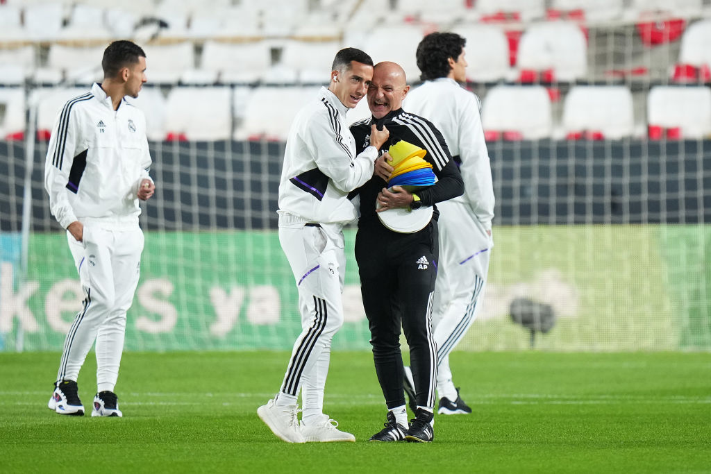 Lucas Vazquez of Real Madrid CF interacts with Antonio Pintus, Conditioning Coach of Real Madrid CF prior to the LaLiga Santander match between Rayo Vallecano and Real Madrid CF at Campo de Futbol de Vallecas on November 07, 2022 in Madrid, Spain. (Photo by Angel Martinez/Getty Images)