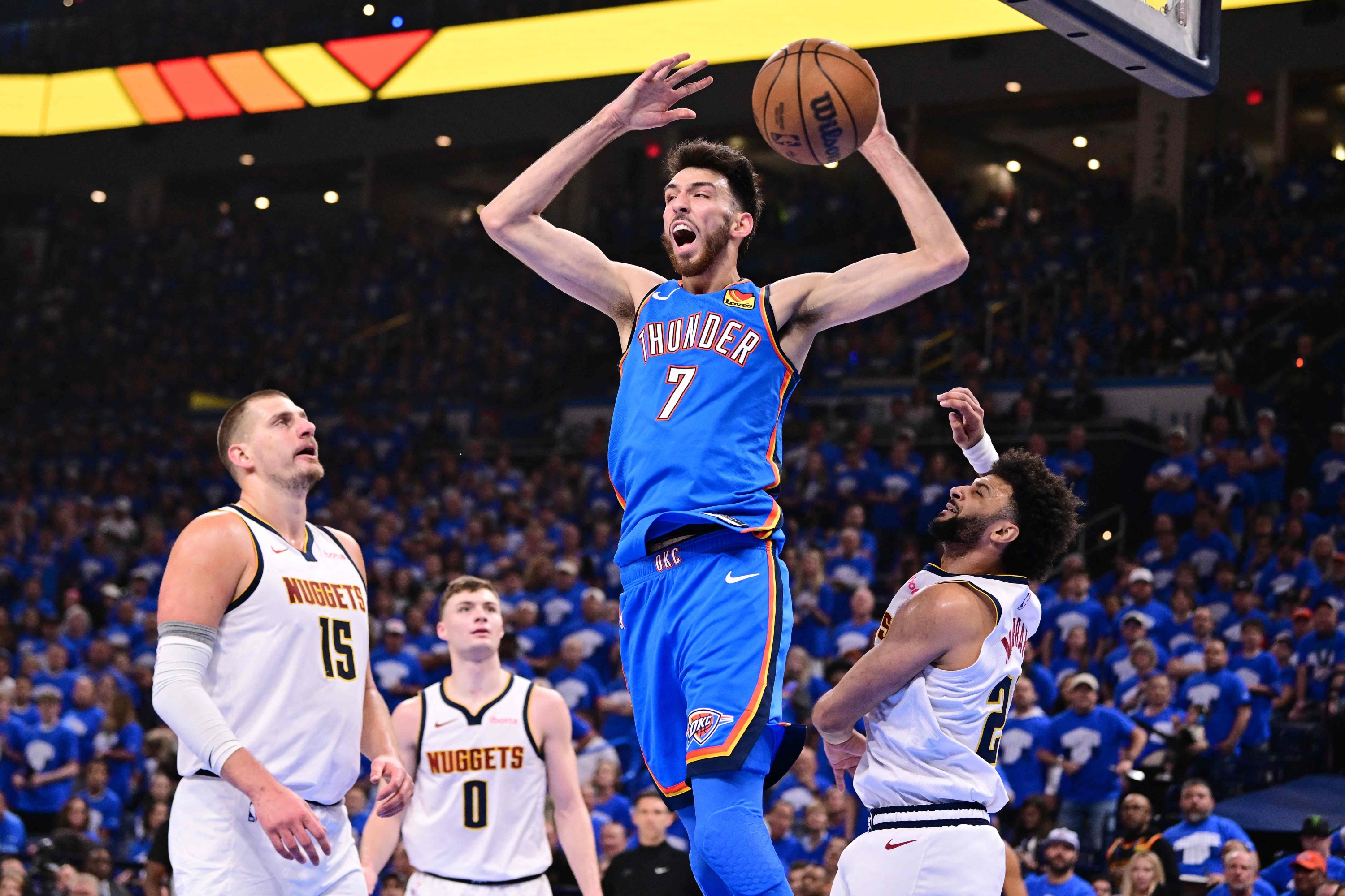 Chet Holmgren #7 of the Oklahoma City Thunder reacts after slam dunking over Nikola Jokic #15 Jamal Murray #27 of the Denver Nuggets during the second quarter in Game Seven of the Western Conference Second Round NBA Playoffs at Paycom Center on May 18, 2025 in Oklahoma City, Oklahoma. NOTE TO USER: User expressly acknowledges and agrees that, by downloading and or using this photograph, User is consenting to the terms and conditions of the Getty Images License Agreement. Joshua Gateley/Getty Images/AFP (Photo by Joshua Gateley / GETTY IMAGES NORTH AMERICA / Getty Images via AFP)