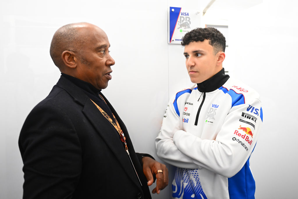 Anthony Hamilton with Isack Hadjar of France and Visa Cash App Racing Bulls in the garage during the F1 Grand Prix of Australia at Albert Park Grand Prix Circuit on March 16, 2025 in Melbourne, Australia. (Photo by Rudy Carezzevoli/Getty Images)
