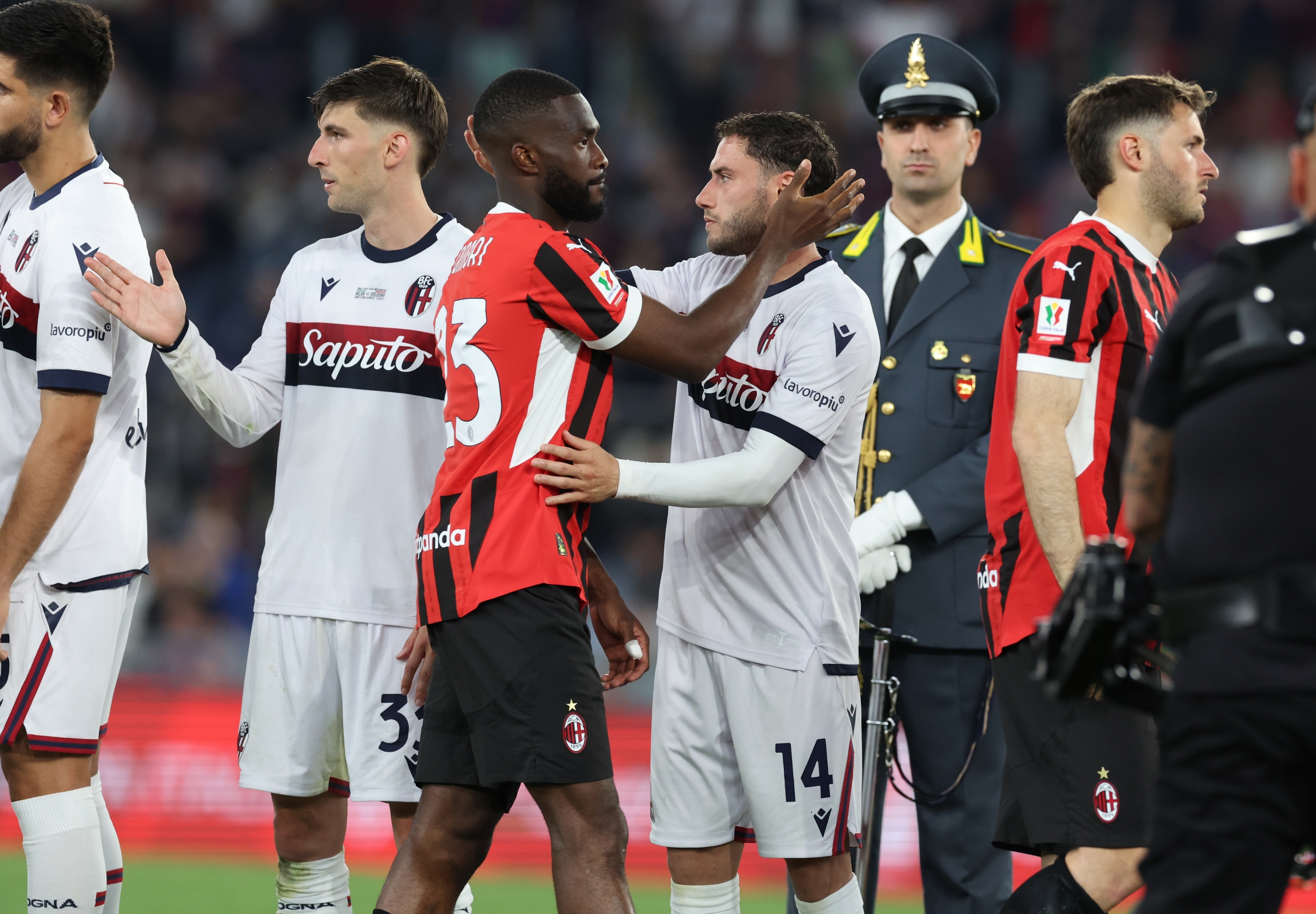 Fikayo Tomori of AC Milan reacts with Davide Calabria of Bologna at the end of the Coppa Italia Final match between AC Milan and Bologna at Stadio Olimpico on May 14, 2025 in Rome, Italy. (Photo by Claudio Villa/AC Milan via Getty Images)