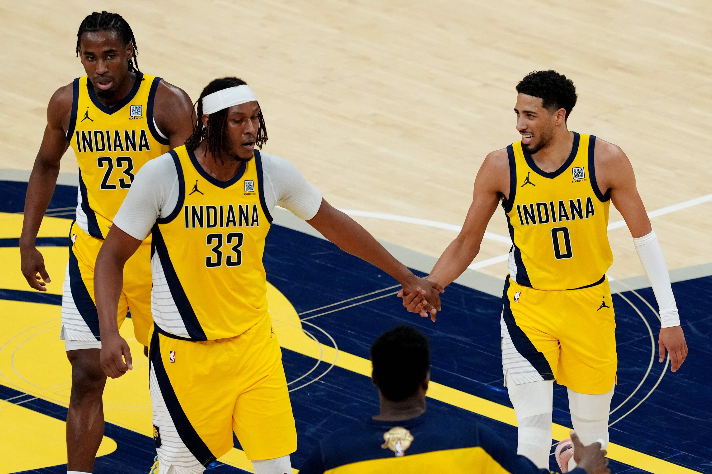 Myles Turner #33 and Tyrese Haliburton #0 of the Indiana Pacers react during the third quarter against the Oklahoma City Thunder in Game Six of the 2025 NBA Finals at Gainbridge Fieldhouse on June 19, 2025 in Indianapolis, Indiana. NOTE TO USER: User expressly acknowledges and agrees that, by downloading and or using this photograph, User is consenting to the terms and conditions of the Getty Images License Agreement. Dylan Buell/Getty Images/AFP (Photo by Dylan Buell / GETTY IMAGES NORTH AMERICA / Getty Images via AFP)