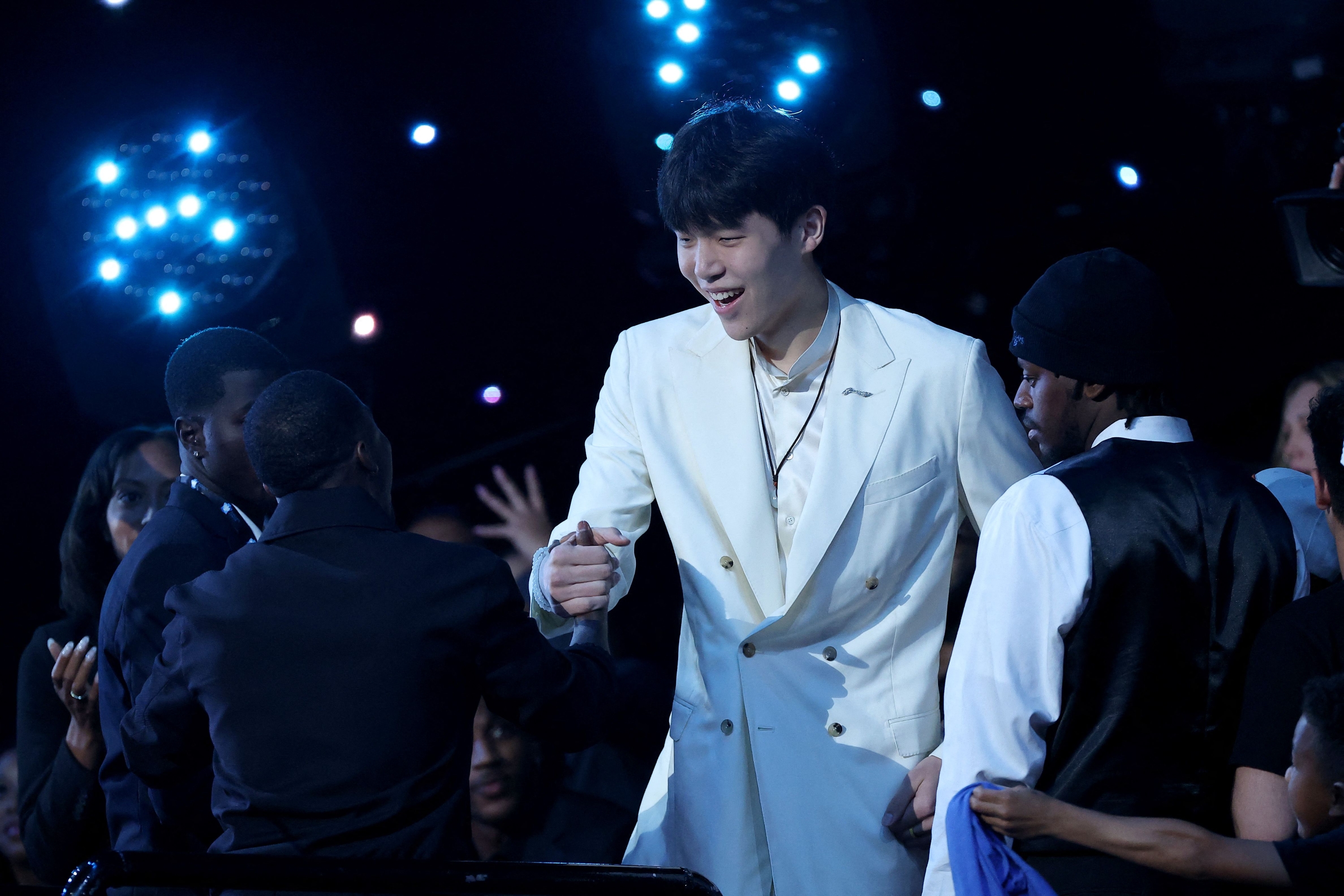 NEW YORK, NEW YORK - JUNE 25: Yang Hansen reacts after being drafted sixteenth overall by the Memphis Grizzlies during the first round of the 2025 NBA Draft at Barclays Center on June 25, 2025 in the Brooklyn borough of New York City. NOTE TO USER: User expressly acknowledges and agrees that, by downloading and/or using this photograph, user is consenting to the terms and conditions of the Getty Images License Agreement. Sarah Stier/Getty Images/AFP (Photo by Sarah Stier / GETTY IMAGES NORTH AMERICA / Getty Images via AFP)