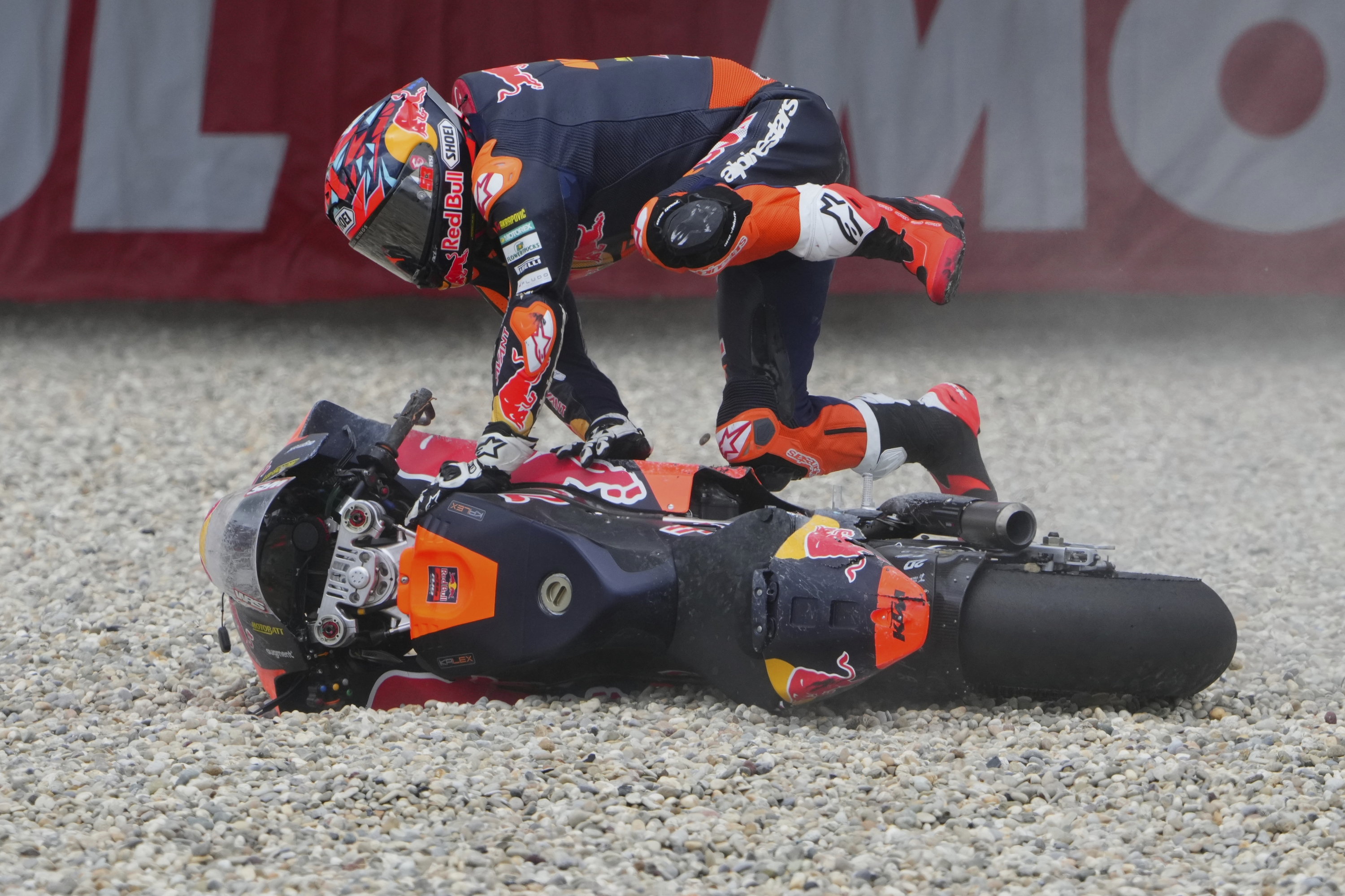 Turkey's rider Deniz Oncu Red Bull KTM Ajo crashes during the Moto2 race at the Grand Prix of the Netherlands at the TT Circuit in Assen, northern Netherlands, Sunday, June 29, 2025. (AP Photo/Peter Dejong)