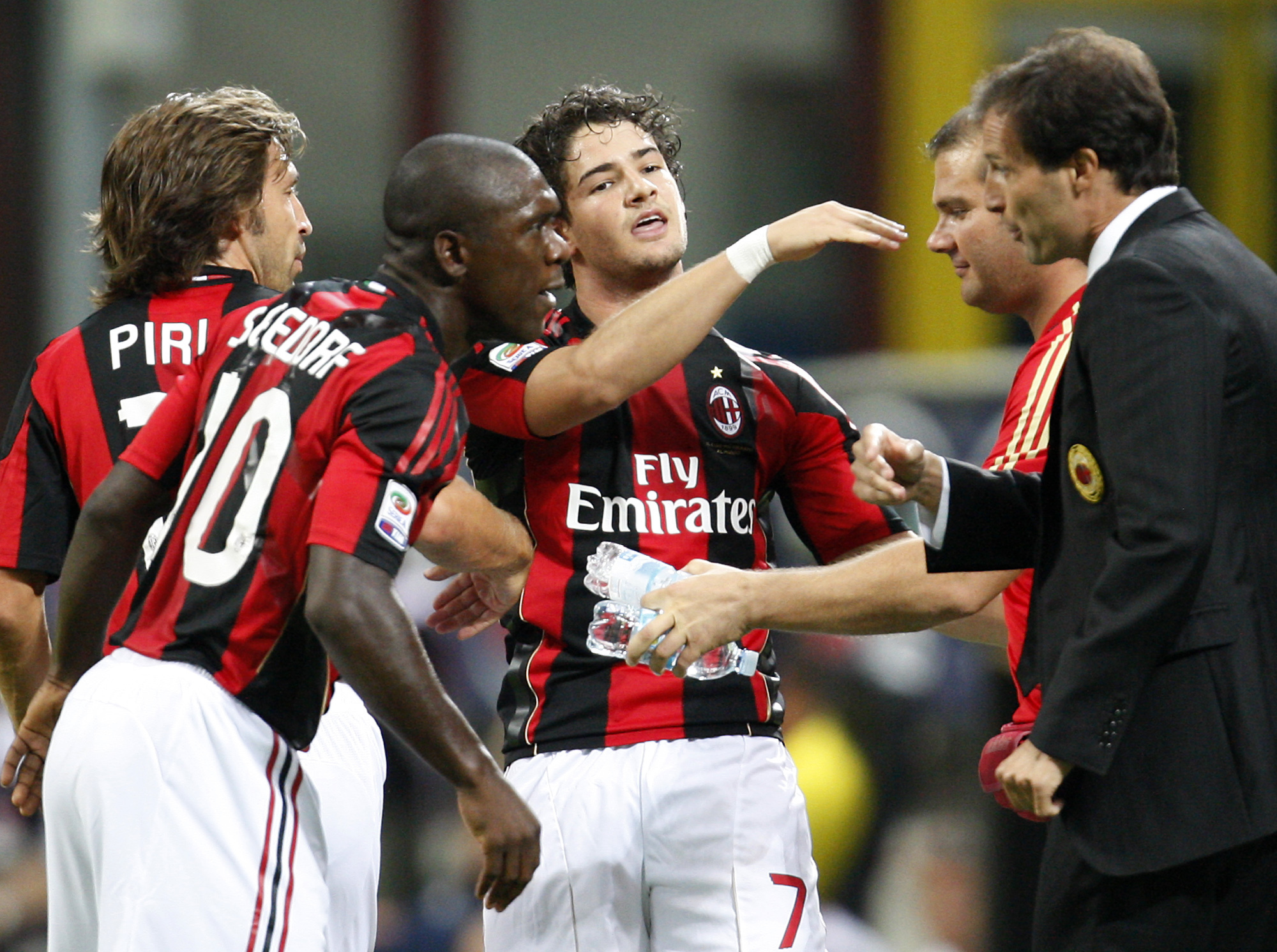 FILE -AC Milan Brazilian forward Pato, center, celebrates with his teammates from left, Andrea Pirlo, Clarence Seedorf of the Netherlands, and coach Massimiliano Allegri, right, after scoring during the Serie A soccer match between AC Milan and Lecce at the San Siro stadium in Milan, Italy, Aug 29, 2010. (AP Photo / Antonio Calanni, File)