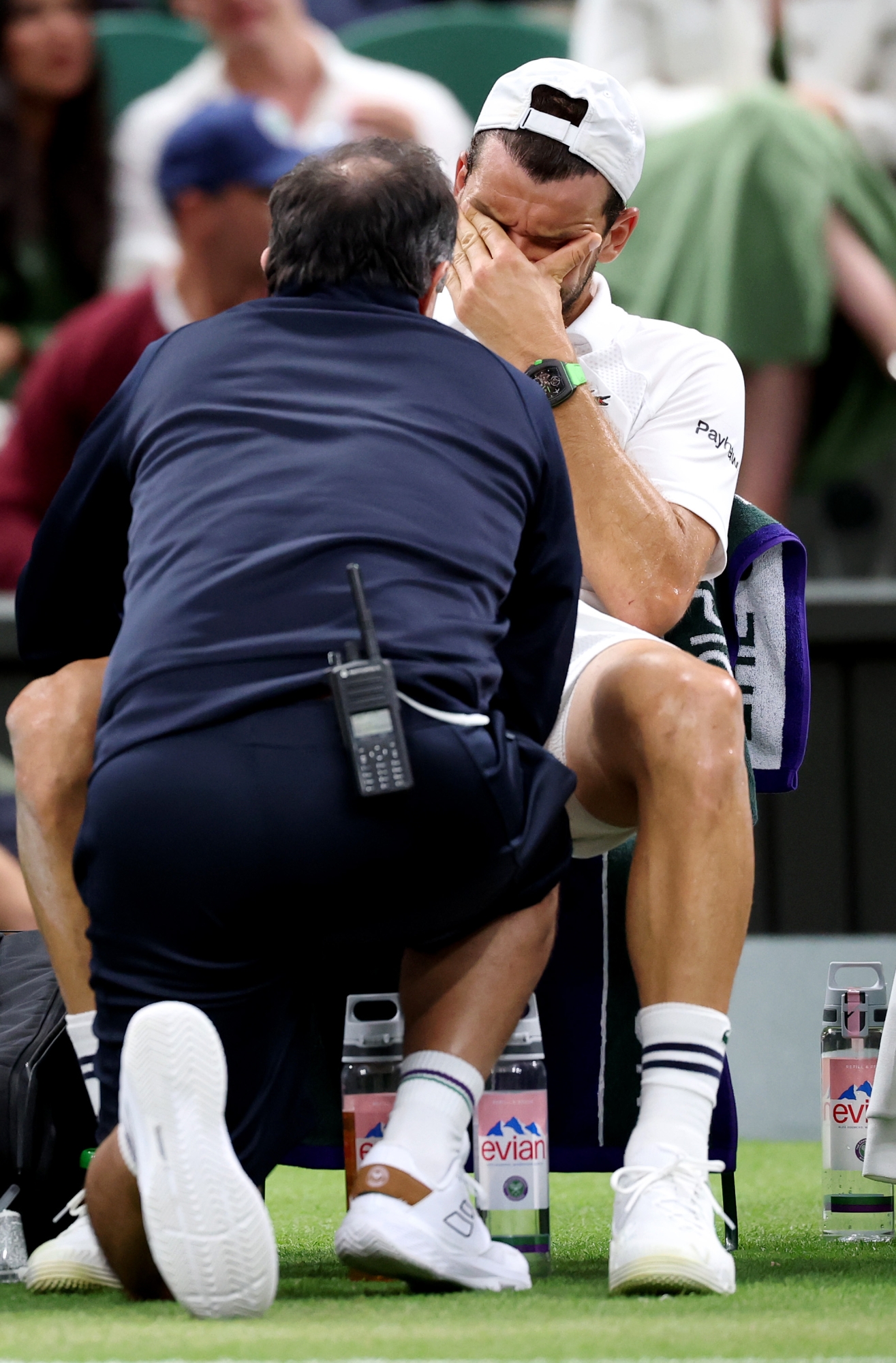  Grigor Dimitrov of Bulgaria reacts as he receives medical attention against Jannik Sinner of Italy during the Gentlemen's Singles fourth round match on day eight of The Championships Wimbledon 2025 at All England Lawn Tennis and Croquet Club on July 07, 2025 in London, England. (Photo by Julian Finney/Getty Images)