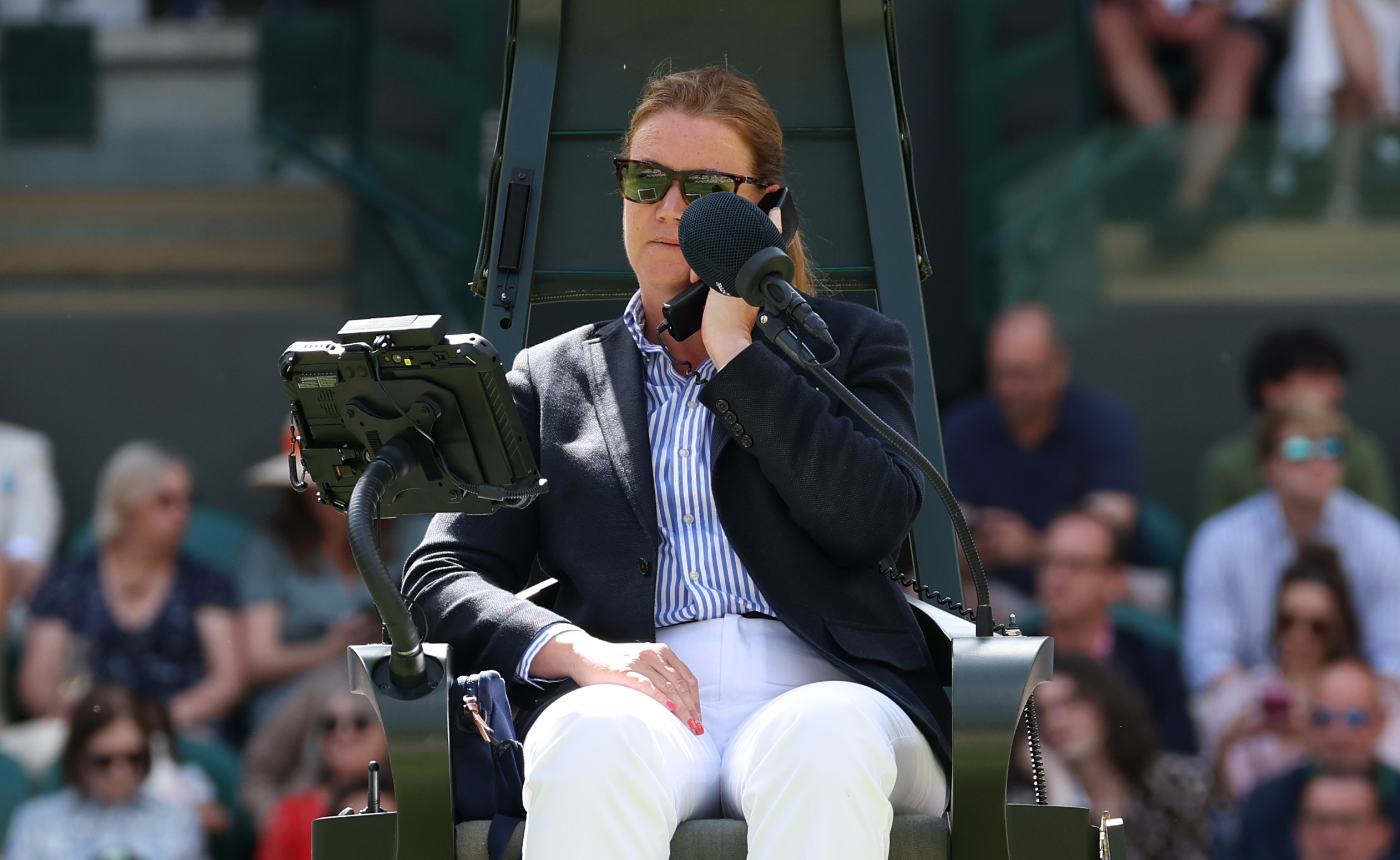 Chair umpire, Louise Azemar-Engzell uses the telephone during the Gentleman's Singles Quarter Final match between Taylor Fritz of United States and Karen Khachanov on day nine of The Championships Wimbledon 2025 at All England Lawn Tennis and Croquet Club on July 08, 2025 in London, England. (Photo by Clive Brunskill/Getty Images)