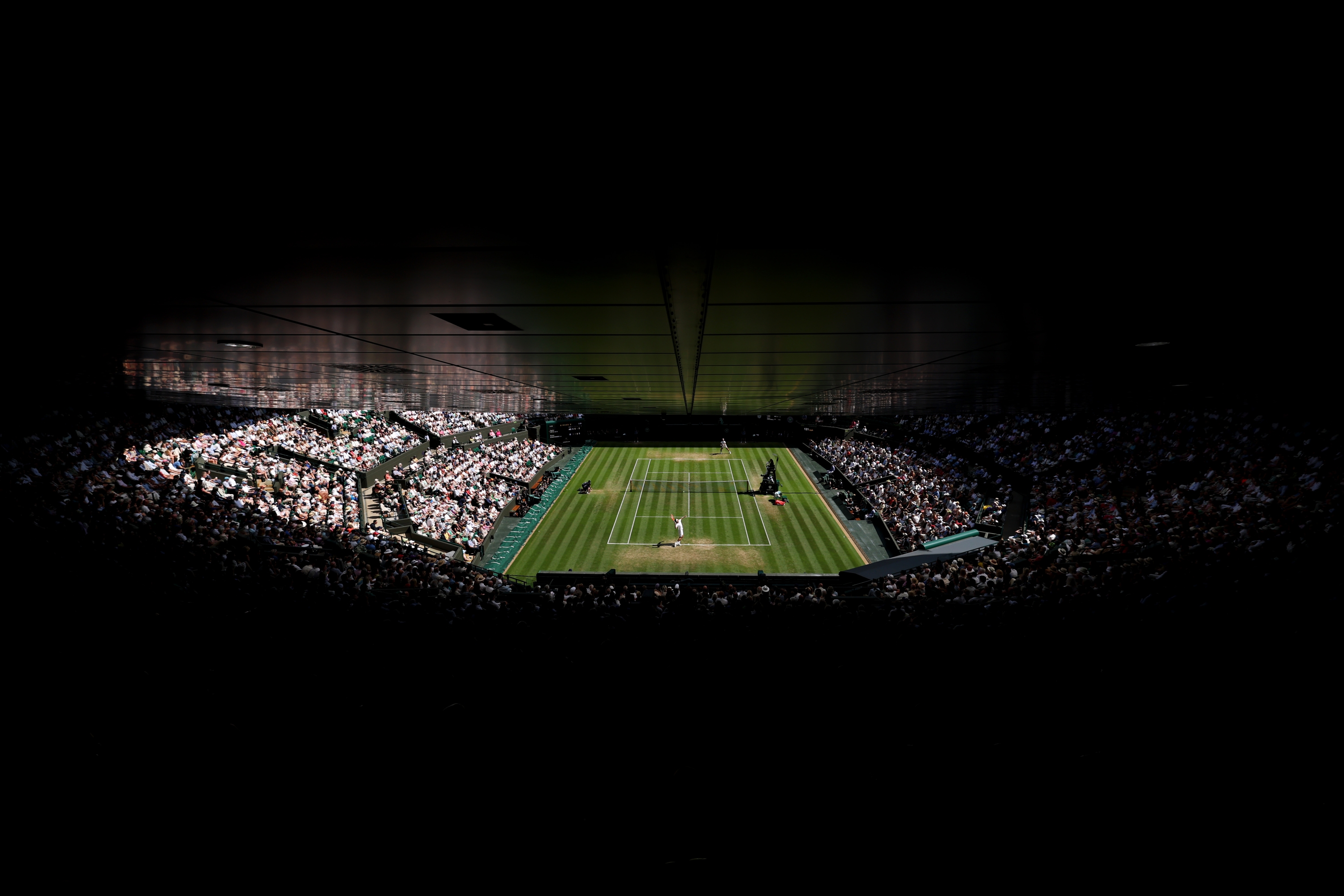 A general view over Court One as Taylor Fritz of United States serves against Karen Khachanov during the Gentlemen's Singles quarter-final match on day nine of The Championships Wimbledon 2025 at All England Lawn Tennis and Croquet Club on July 08, 2025 in London, England. (Photo by Ezra Shaw/Getty Images)