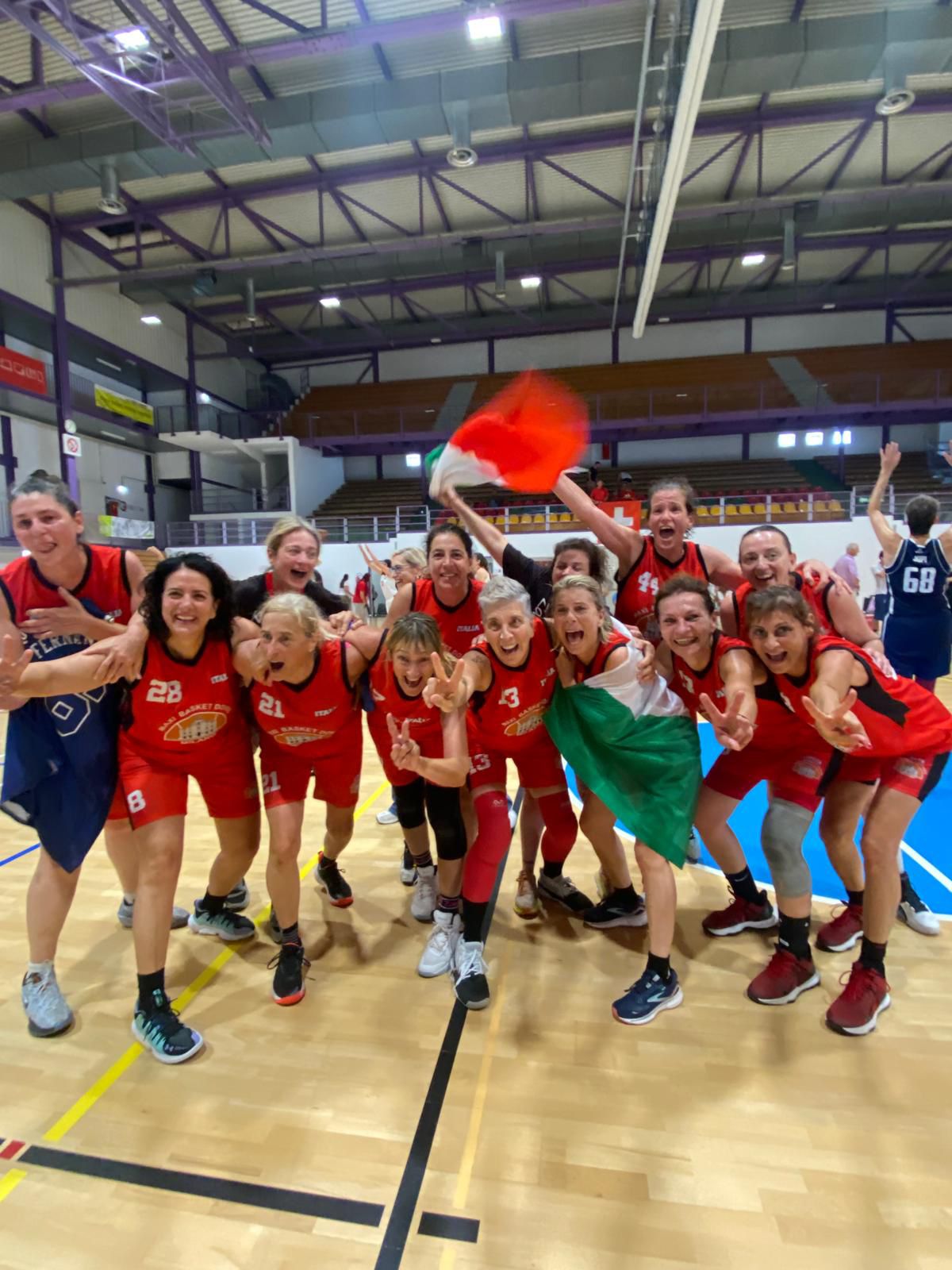Italian Over 55 Women`s Basketball Team celebrating victory