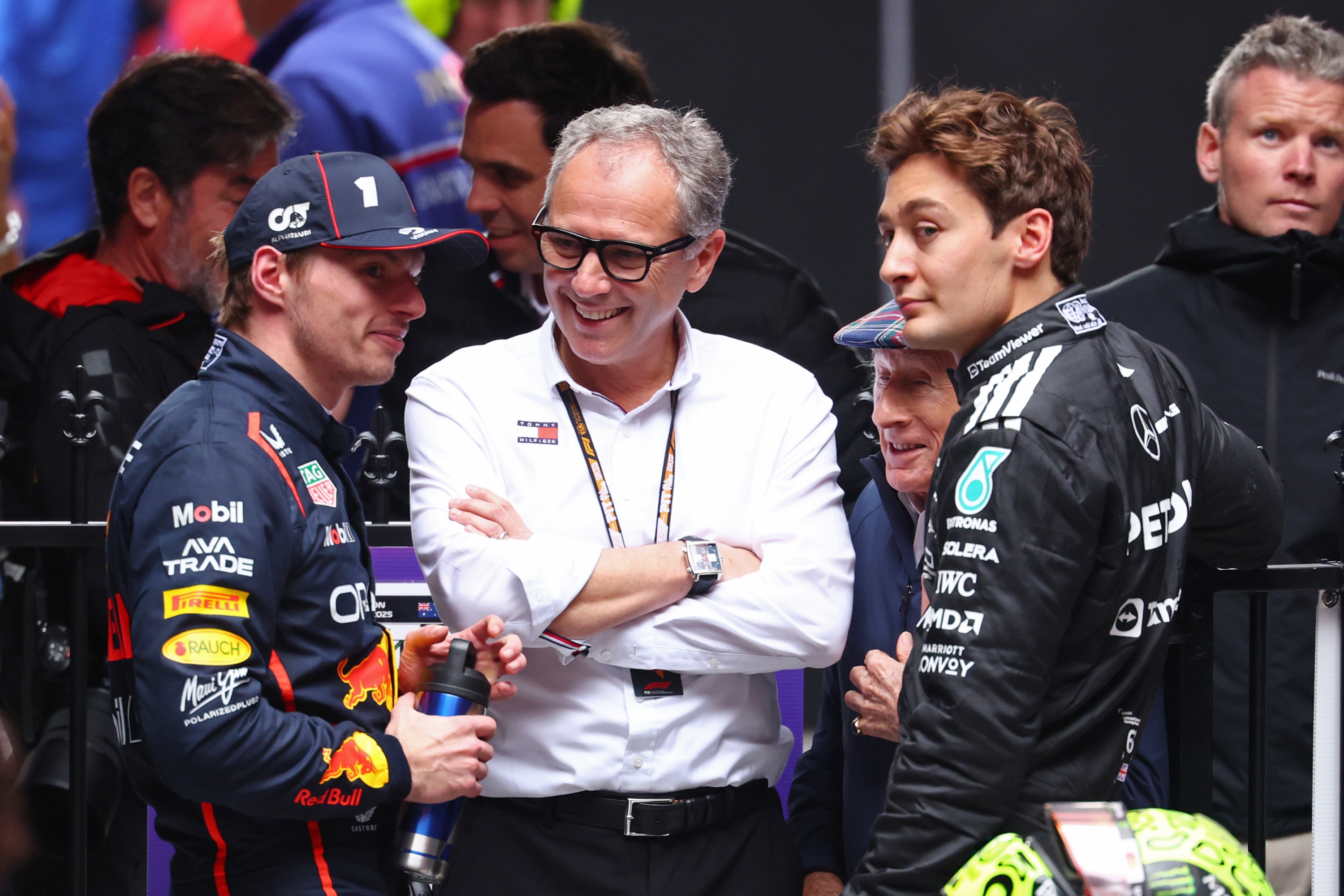  Second placed Max Verstappen of the Netherlands and Oracle Red Bull Racing and Third placed George Russell of Great Britain and Mercedes AMG Petronas F1 Team with Stefano Domenicali, CEO of the Formula One Group in parc ferme during the F1 Grand Prix of Australia at Albert Park Grand Prix Circuit on March 16, 2025 in Melbourne, Australia. (Photo by Clive Rose/Getty Images)