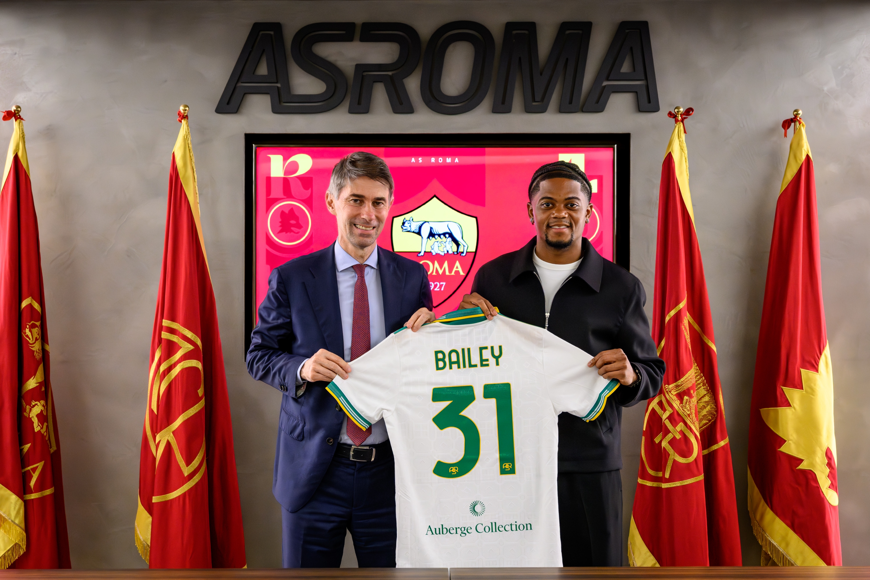 AS Roma new signing Leon Bailey, with the Sports Director Frederic Massara, poses with his new jersey at Centro Sportivo Fulvio Bernardini on August 20, 2025 in Rome, Italy. (Photo by Fabio Rossi/AS Roma via Getty Images)