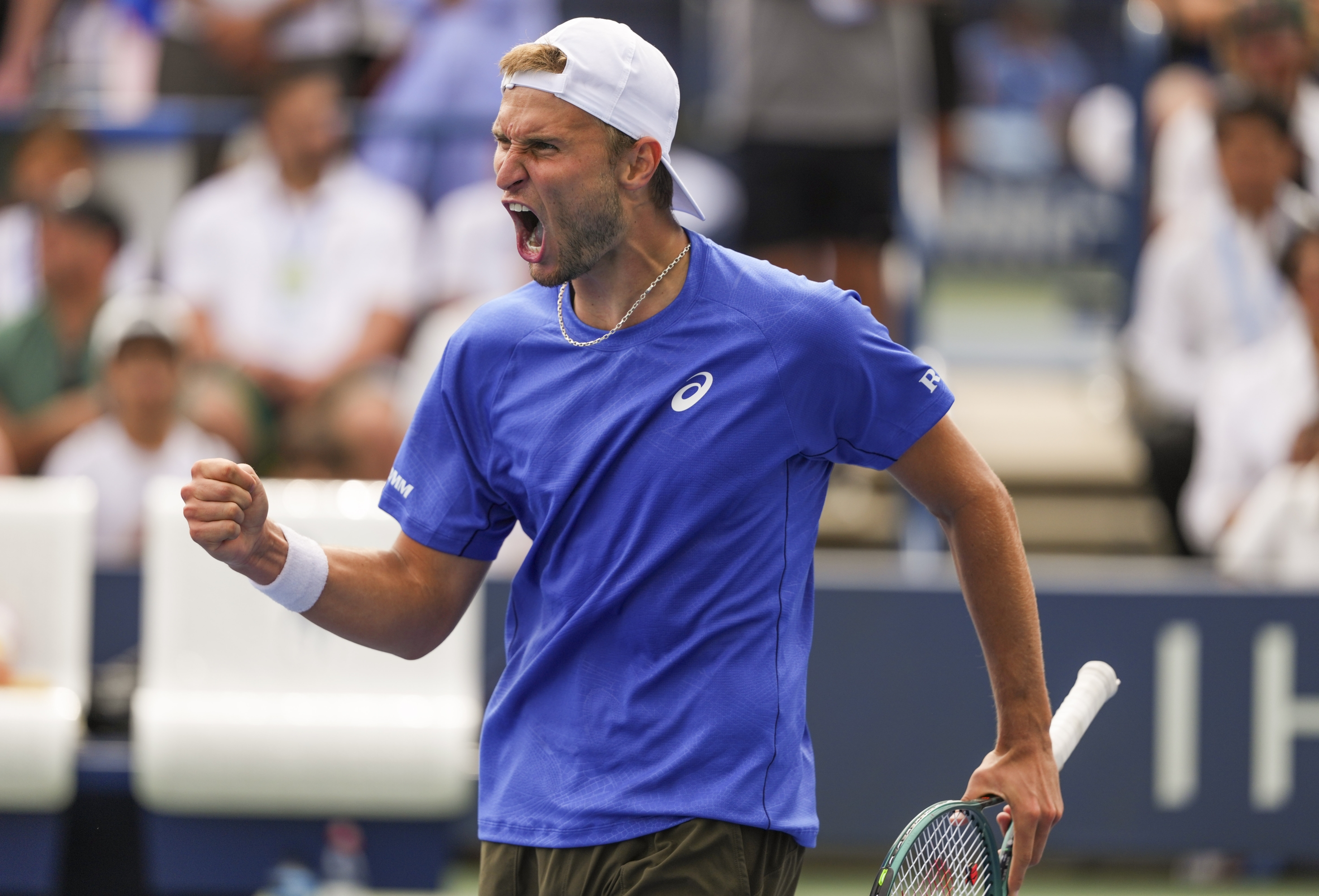 Leandro Riedi, of Switzerland, reacts after scoring a point against Francisco Cerundolo, of Argentina, during the second round of the U.S. Open tennis championships, Thursday, Aug. 28, 2025, in New York. (AP Photo/Kirsty Wigglesworth)