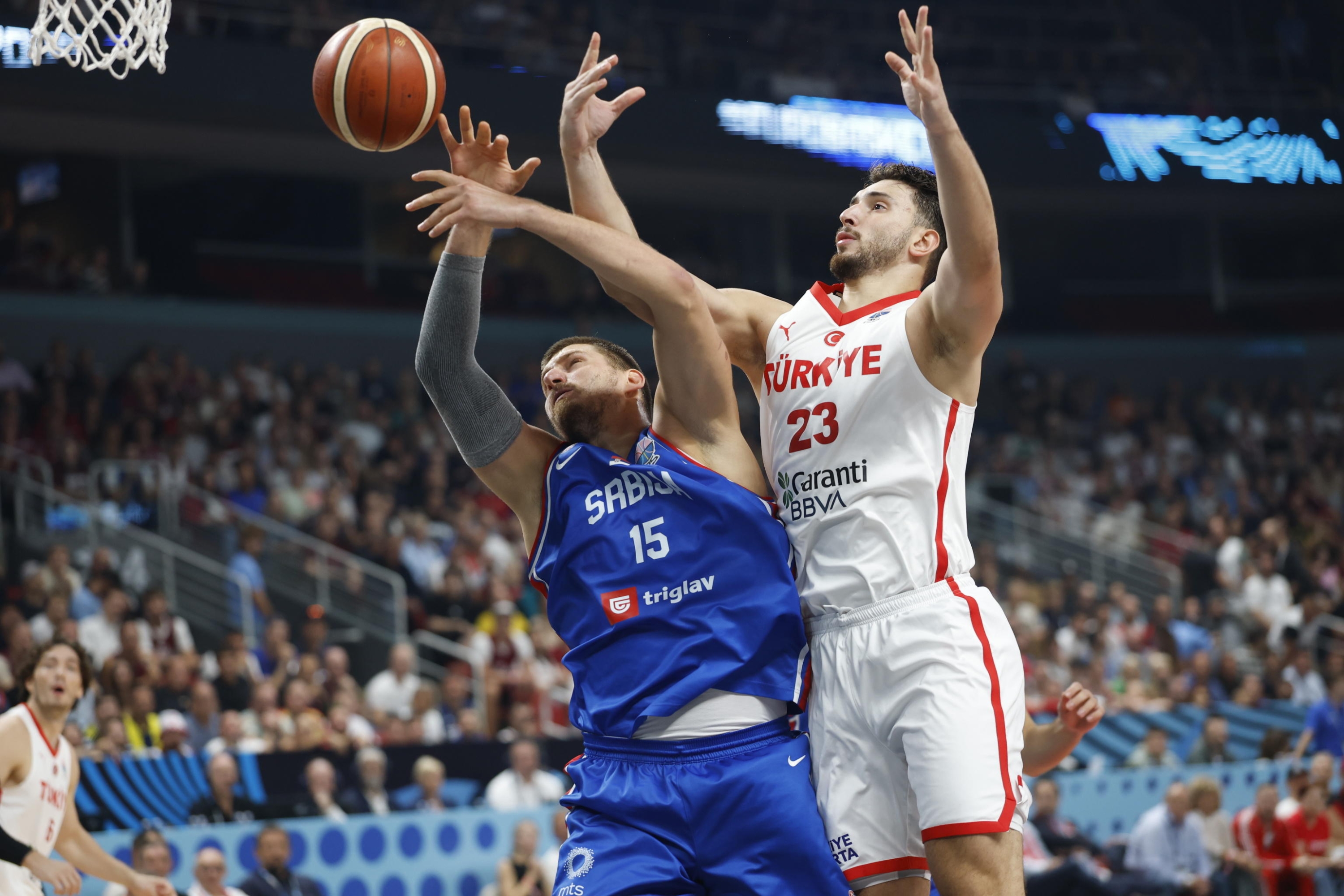 Alperen Sengun of Turkey and Nikola Jokic of Serbia in action during EuroBasket 2025