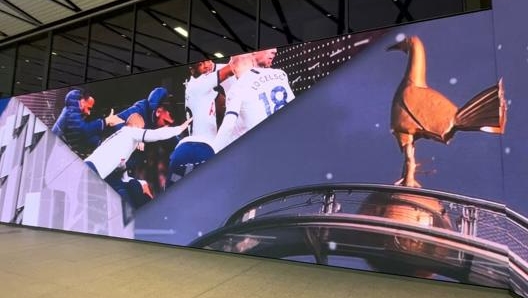 Long LED screen in stadium corridor