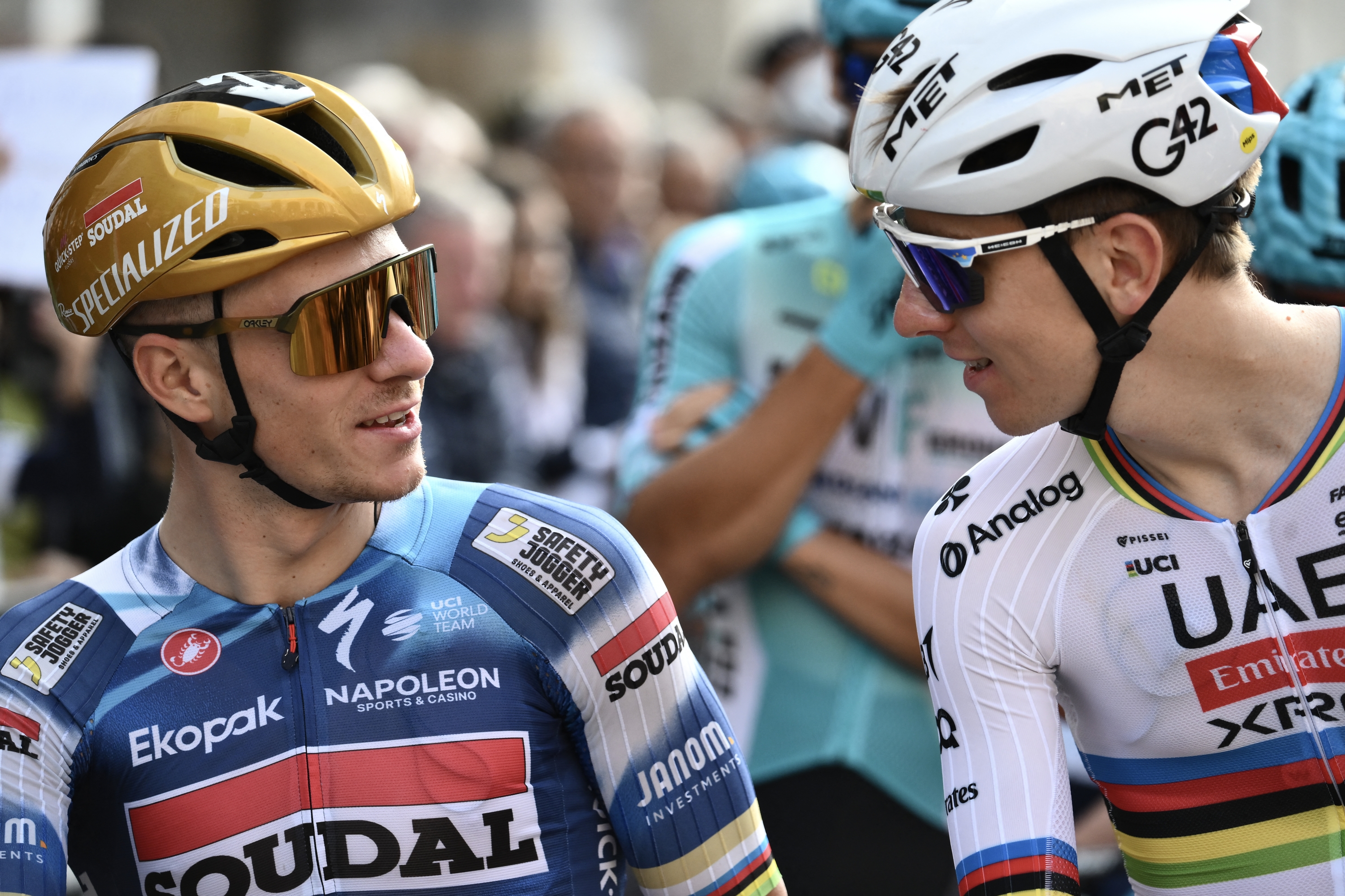 Soudal Quick-Step’s Belgian rider Remco Evenepoel (L) speaks with UAE Team Emirates’s Slovenian rider Tadej Pogacar (R) ahead of the 119th edition of the Giro di Lombardia (Tour of Lombardy), a 238km cycling race from Como to Bergamo on October 11, 2025. (Photo by Marco BERTORELLO / AFP)