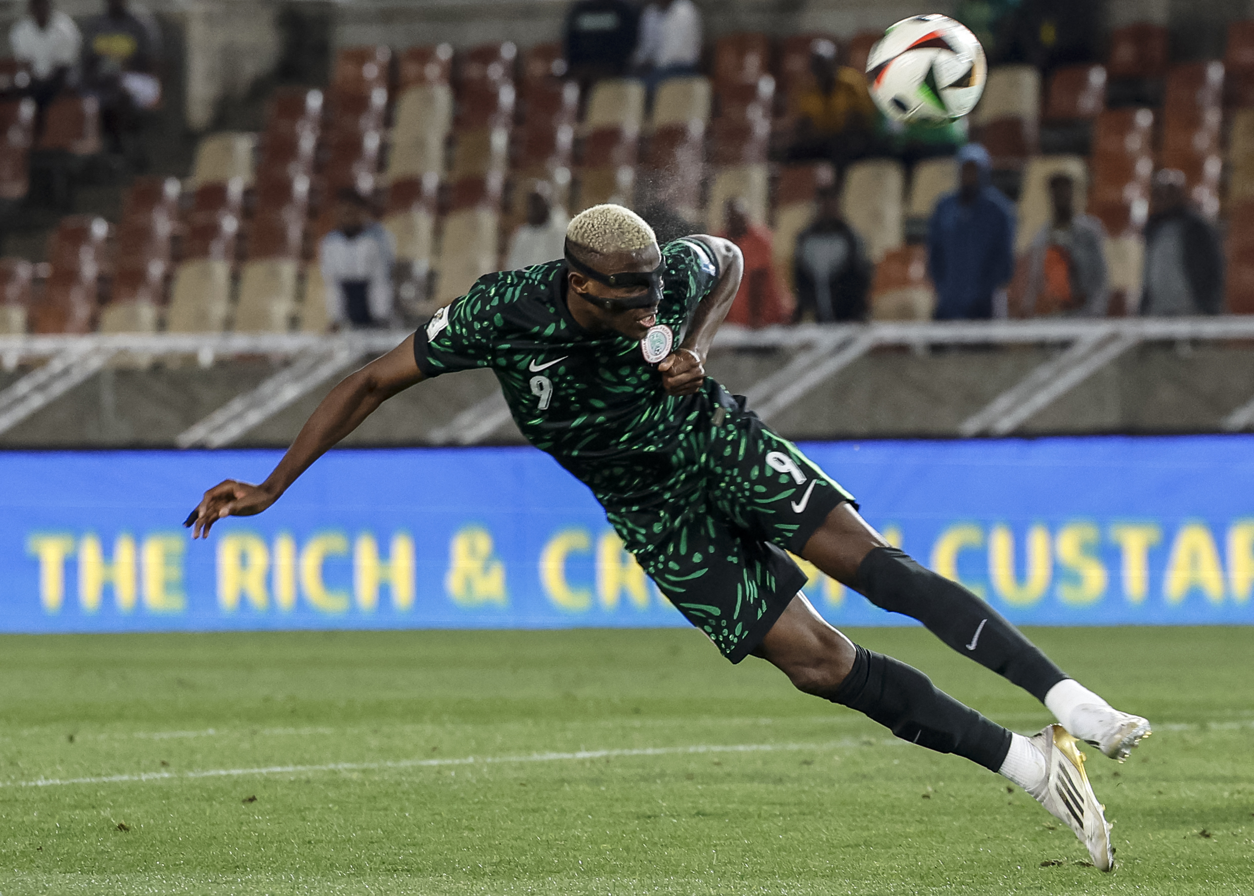 Nigeria's forward #9 Victor Osimhen heads the ball but fails to score during the FIFA World Cup 2026 Africa qualifiers group C match between Lesotho and Nigeria at the Peter Mokaba Stadium in Polokwane on October 10, 2025. (Photo by PHILL MAGAKOE / AFP) / ALTERNATE CROP