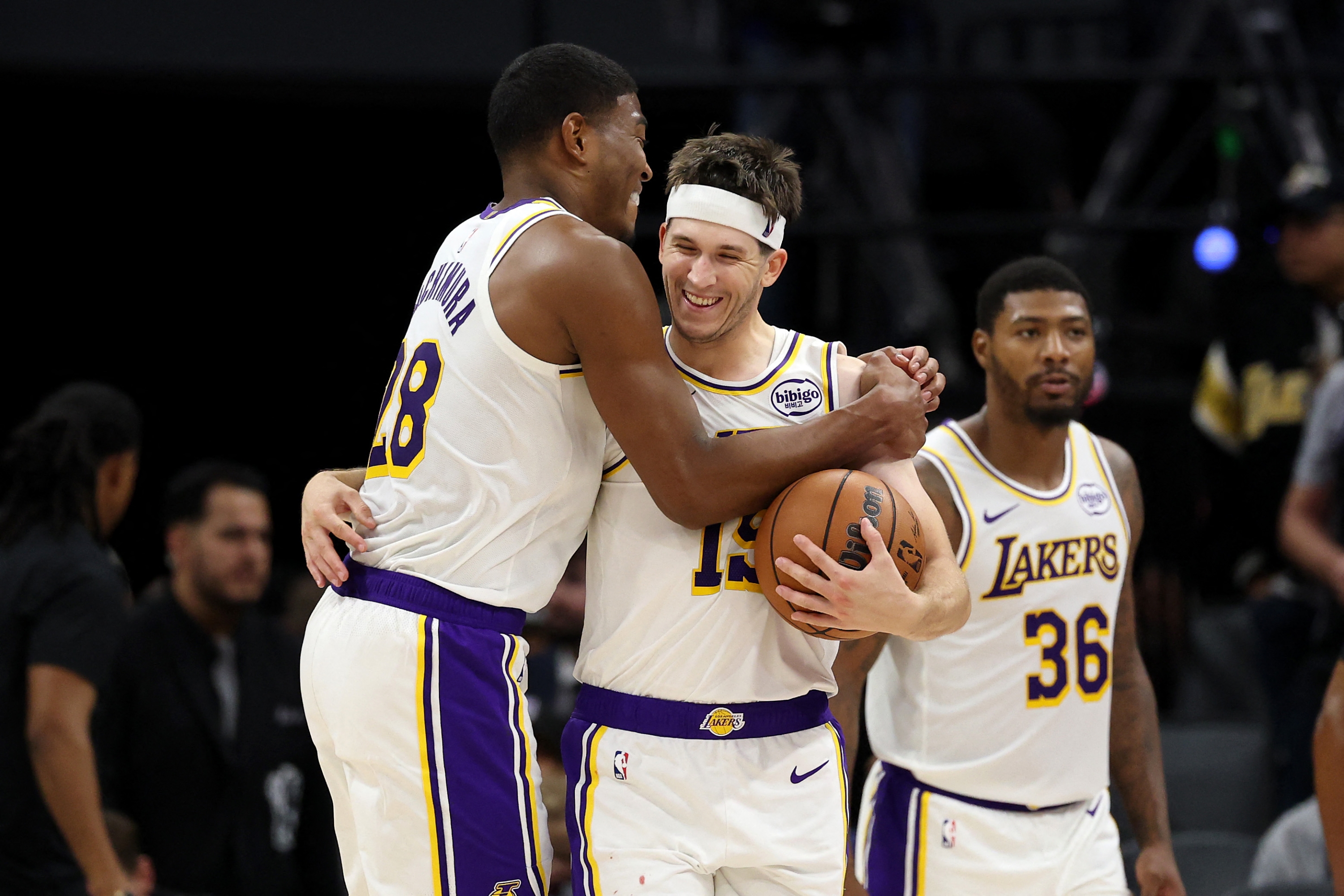 Rui Hachimura #28 congratulates Austin Reaves #15 of the Los Angeles Lakers after they beat the Sacramento Kings at Golden 1 Center on October 26, 2025 in Sacramento, California. Reaves finished with a career high 51 points. NOTE TO USER: User expressly acknowledges and agrees that, by downloading and/or using this photograph, user is consenting to the terms and conditions of the Getty Images License Agreement.   Ezra Shaw/Getty Images/AFP (Photo by EZRA SHAW / GETTY IMAGES NORTH AMERICA / Getty Images via AFP)