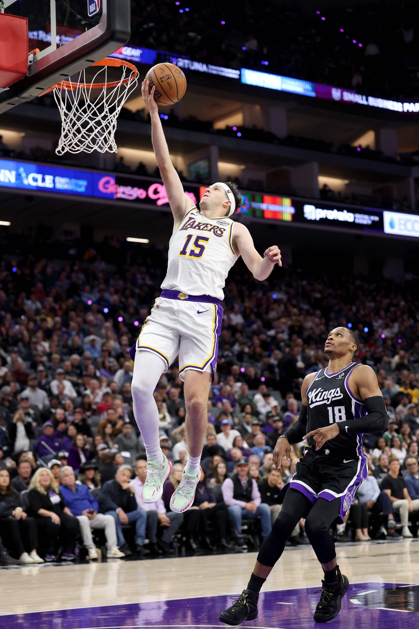 Austin Reaves #15 of the Los Angeles Lakers goes up for a shot on Russell Westbrook #18 of the Sacramento Kings at Golden 1 Center on October 26, 2025 in Sacramento, California. Reaves finished with a career high 51 points. NOTE TO USER: User expressly acknowledges and agrees that, by downloading and/or using this photograph, user is consenting to the terms and conditions of the Getty Images License Agreement.   Ezra Shaw/Getty Images/AFP (Photo by EZRA SHAW / GETTY IMAGES NORTH AMERICA / Getty Images via AFP)