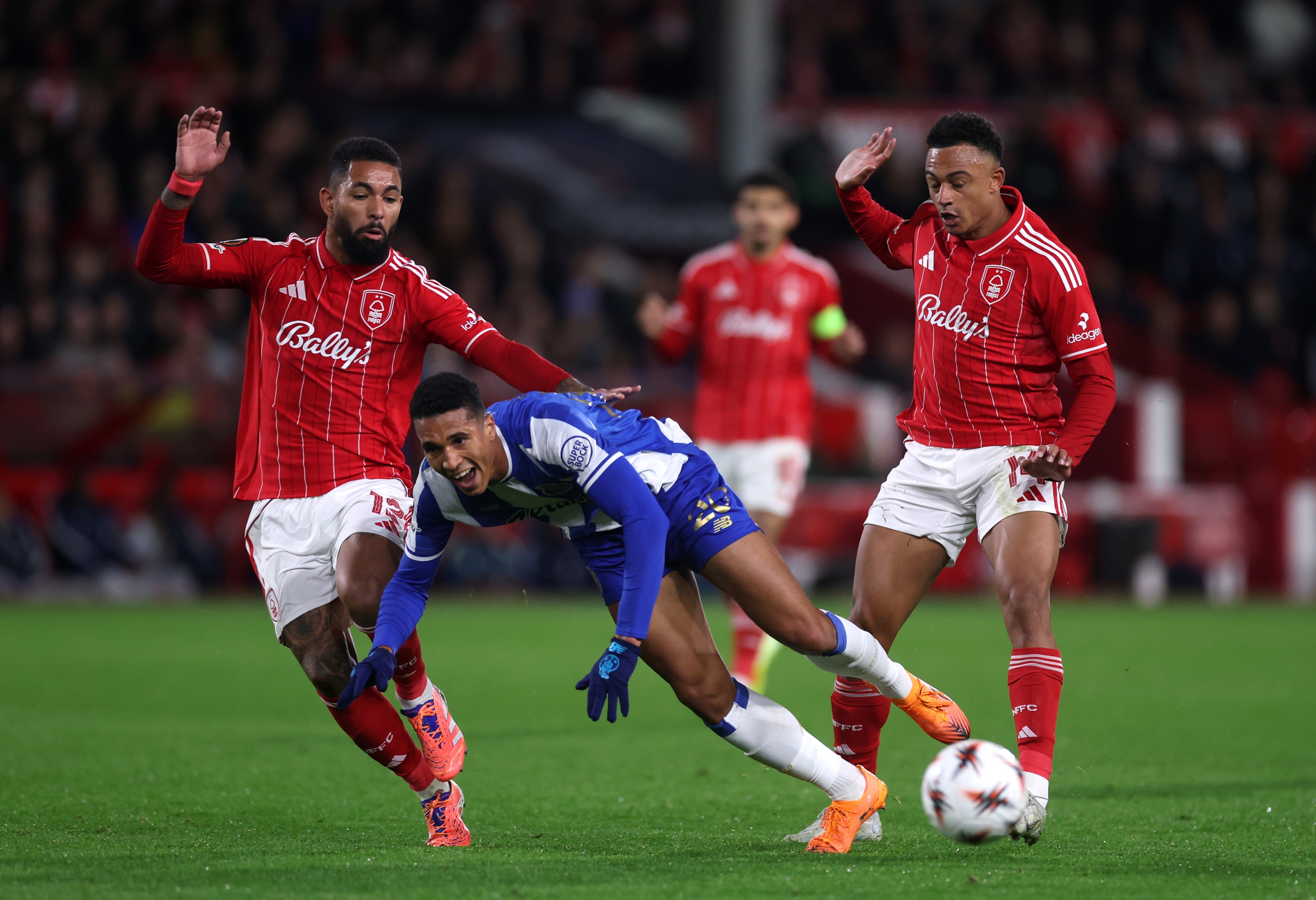 NOTTINGHAM, ENGLAND - OCTOBER 23: Alberto Costa of FC Porto is challenged by Douglas Luiz and Dan Ndoye of Nottingham Forest during the UEFA Europa League 2025/26 League Phase MD3 match between Nottingham Forest FC and FC Porto at City Ground on October 23, 2025 in Nottingham, England. (Photo by Carl Recine/Getty Images)