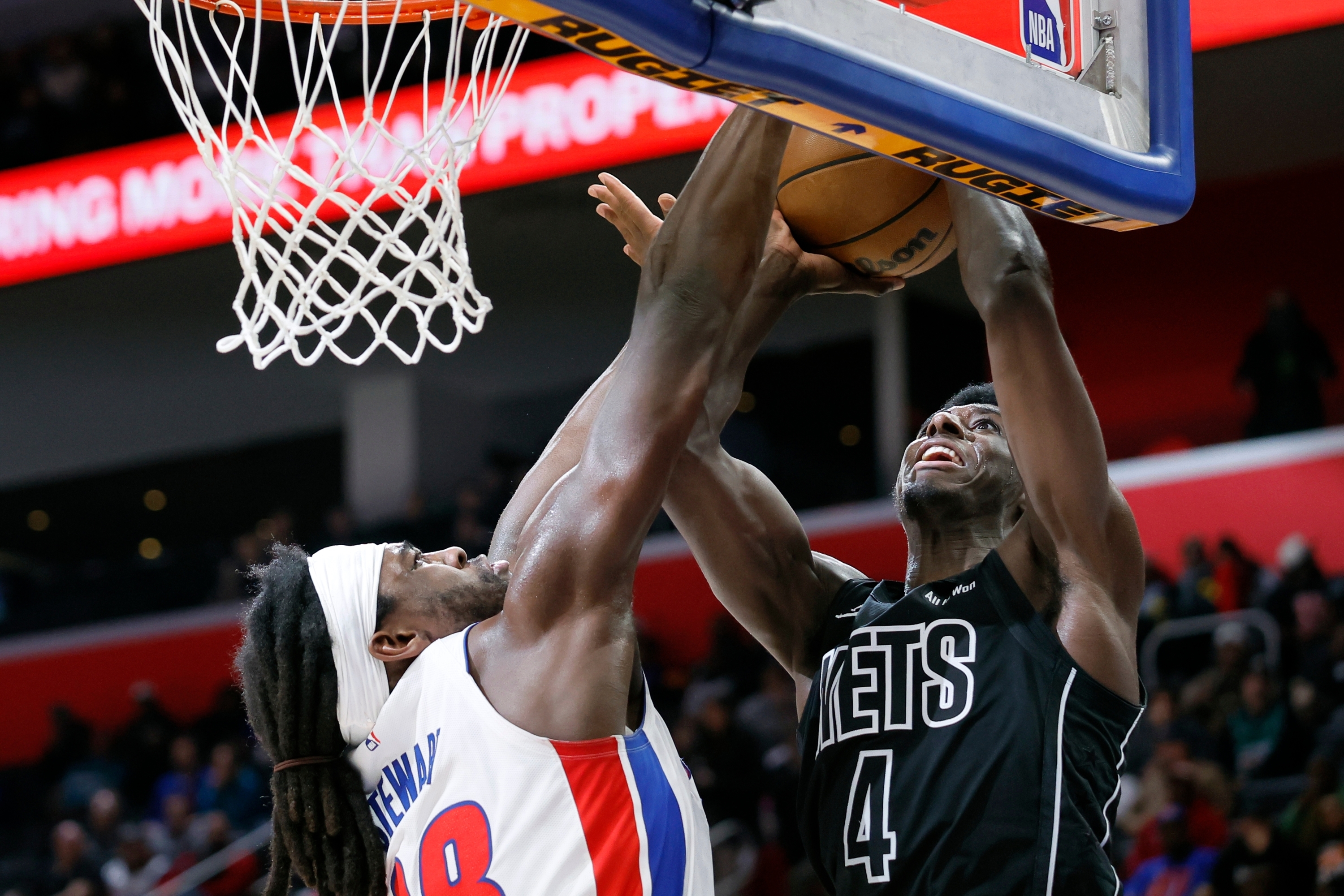 Detroit Pistons forward Isaiah Stewart, left, defends the basket against a shot by Brooklyn Nets guard Drake Powell (4) during the first half of an NBA basketball game Sunday, Feb. 1, 2026, in Detroit. (AP Photo/Duane Burleson)