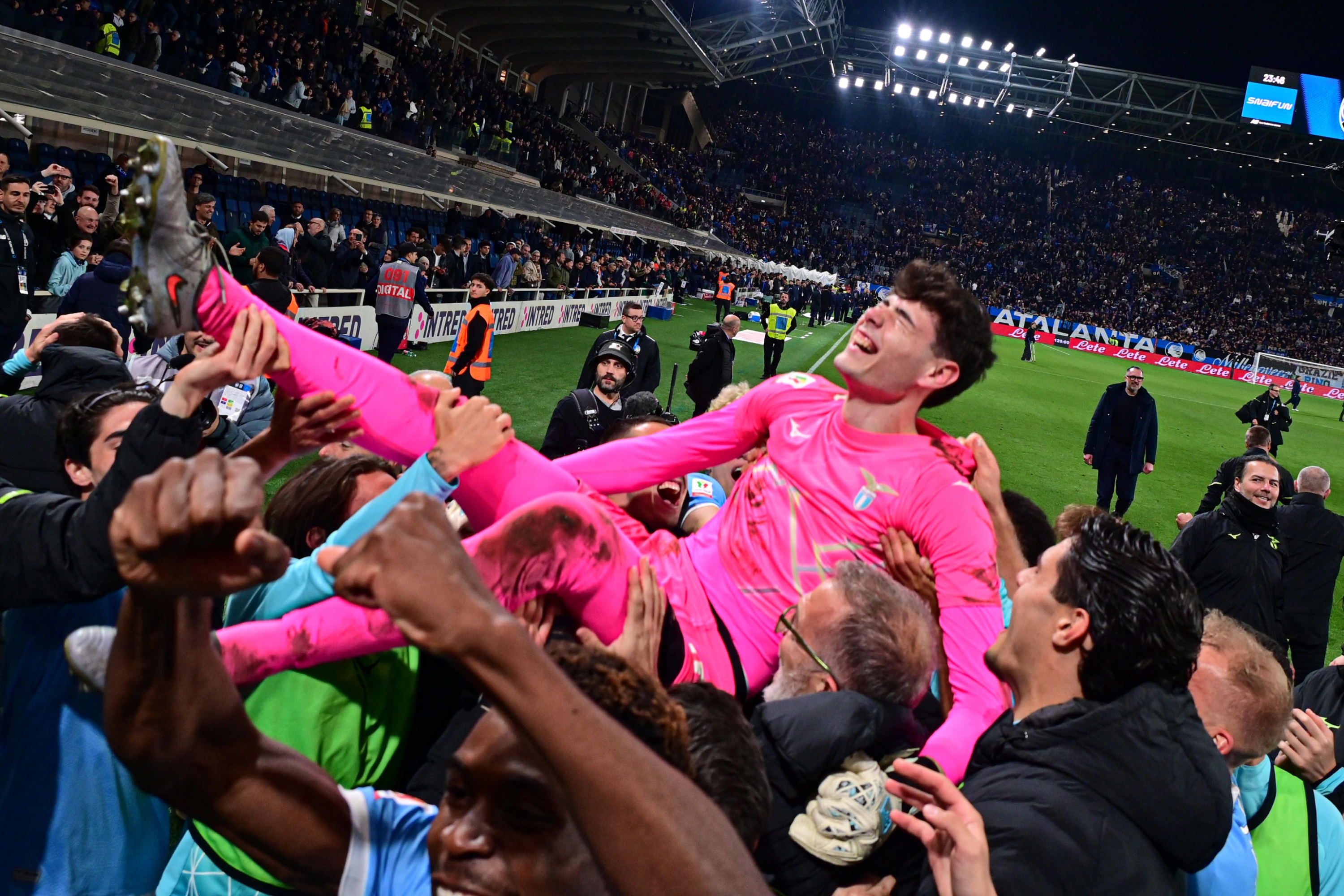 Lazios Edoardo Motta carried in triumph by his teammates at the end of the Italian Cup semi-final 2nd leg soccer match between Atalanta BC vs SS Lazio at New Balance Arena in Bergamo, Italy, 22 April 2026. ANSA/MICHELE MARAVIGLIA