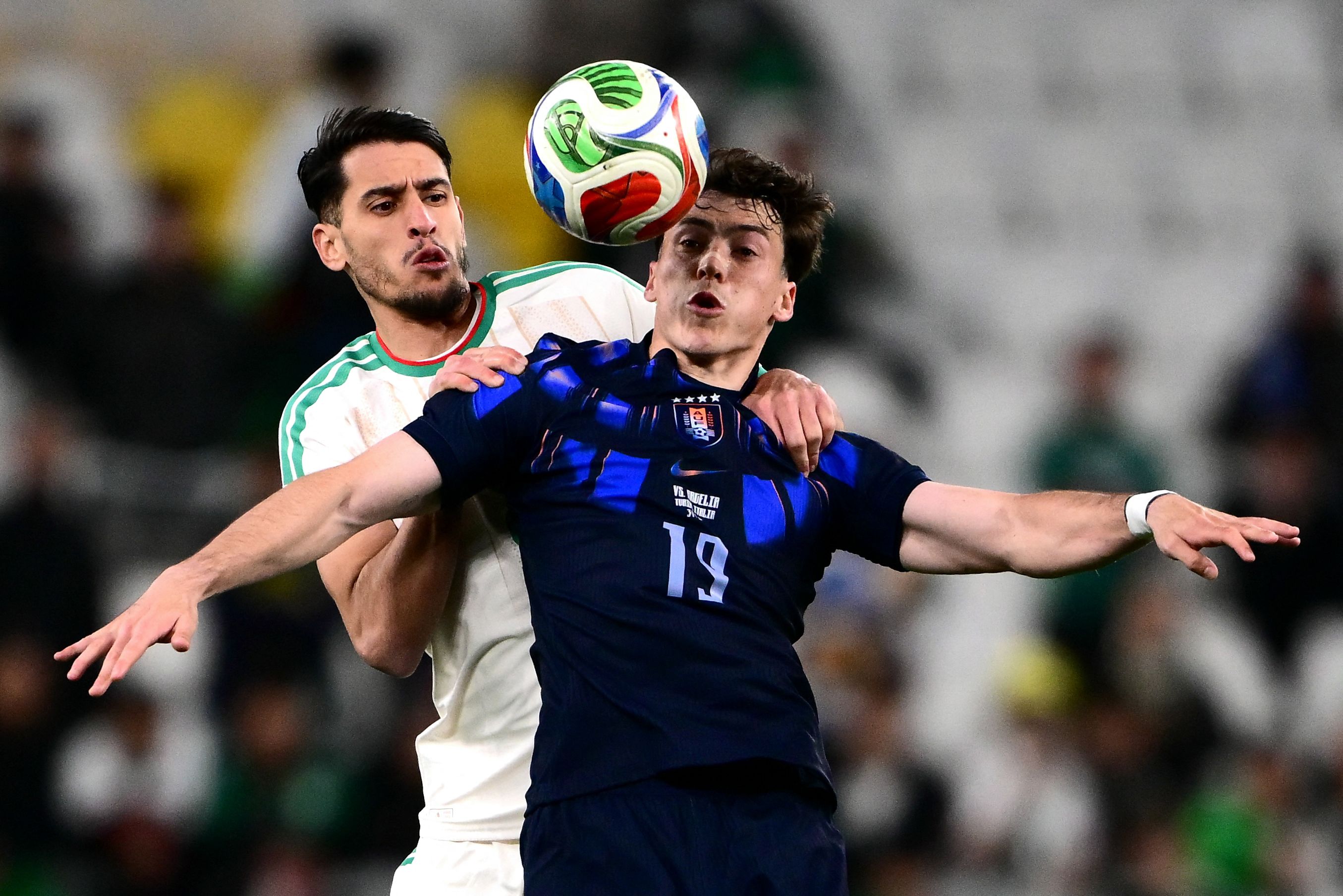 Uruguays forward #19 Federico Vinas (R) fights for the ball with Algerias defender #05 Zineddine Belaid (L) during the friendly international football match between Algeria and Uruguay at the Allianz Stadium in Turin on March 31, 2026. = (Photo by MARCO BERTORELLO / AFP)