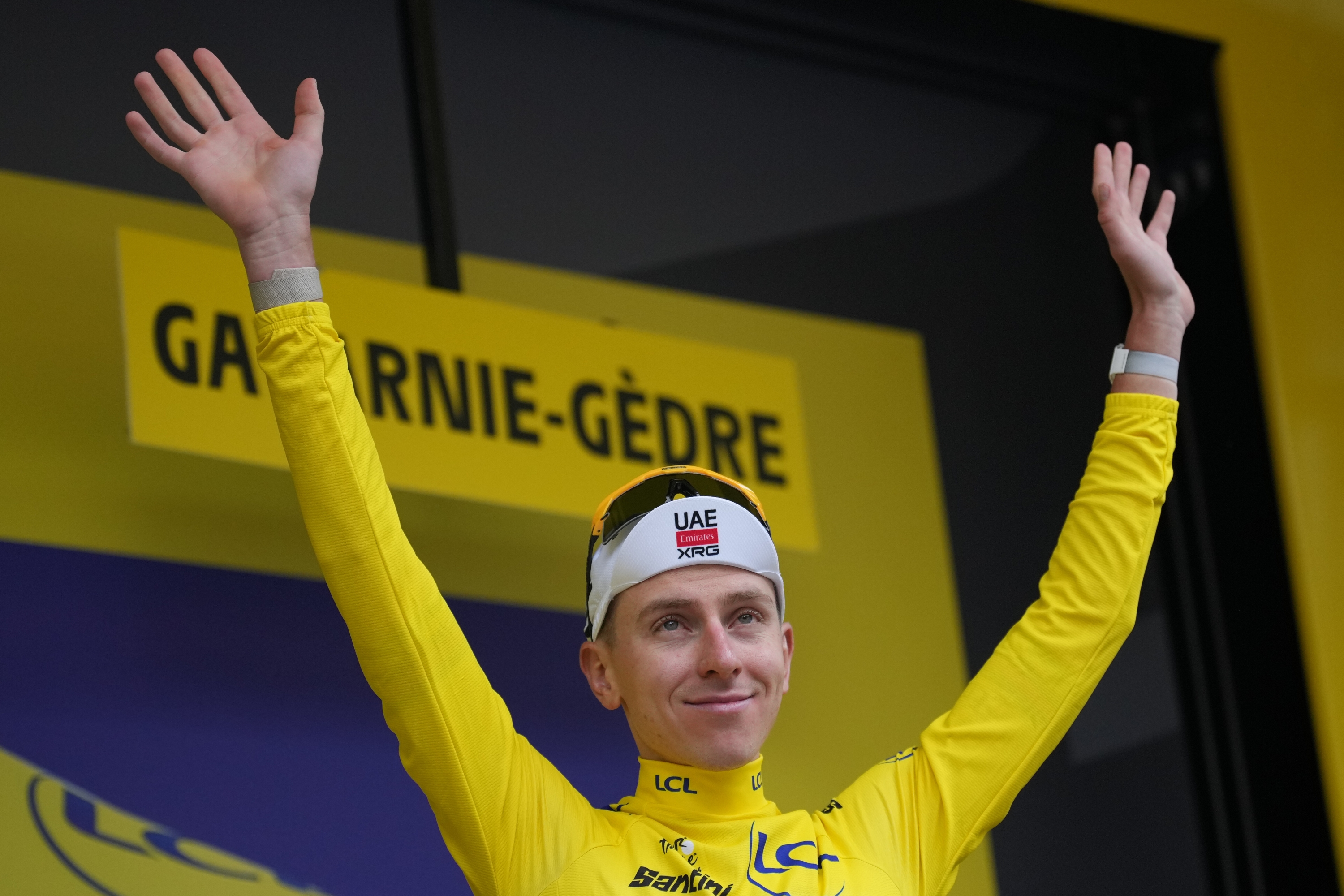 Slovenia's Tadej Pogacar arrives on the podium after winning the sixth stage of the Tour de France cycling race with start in Pau and finish in Gavarnie-Gedre, France, Thursday, July 9, 2026. (AP Photo/Thibault Camus)