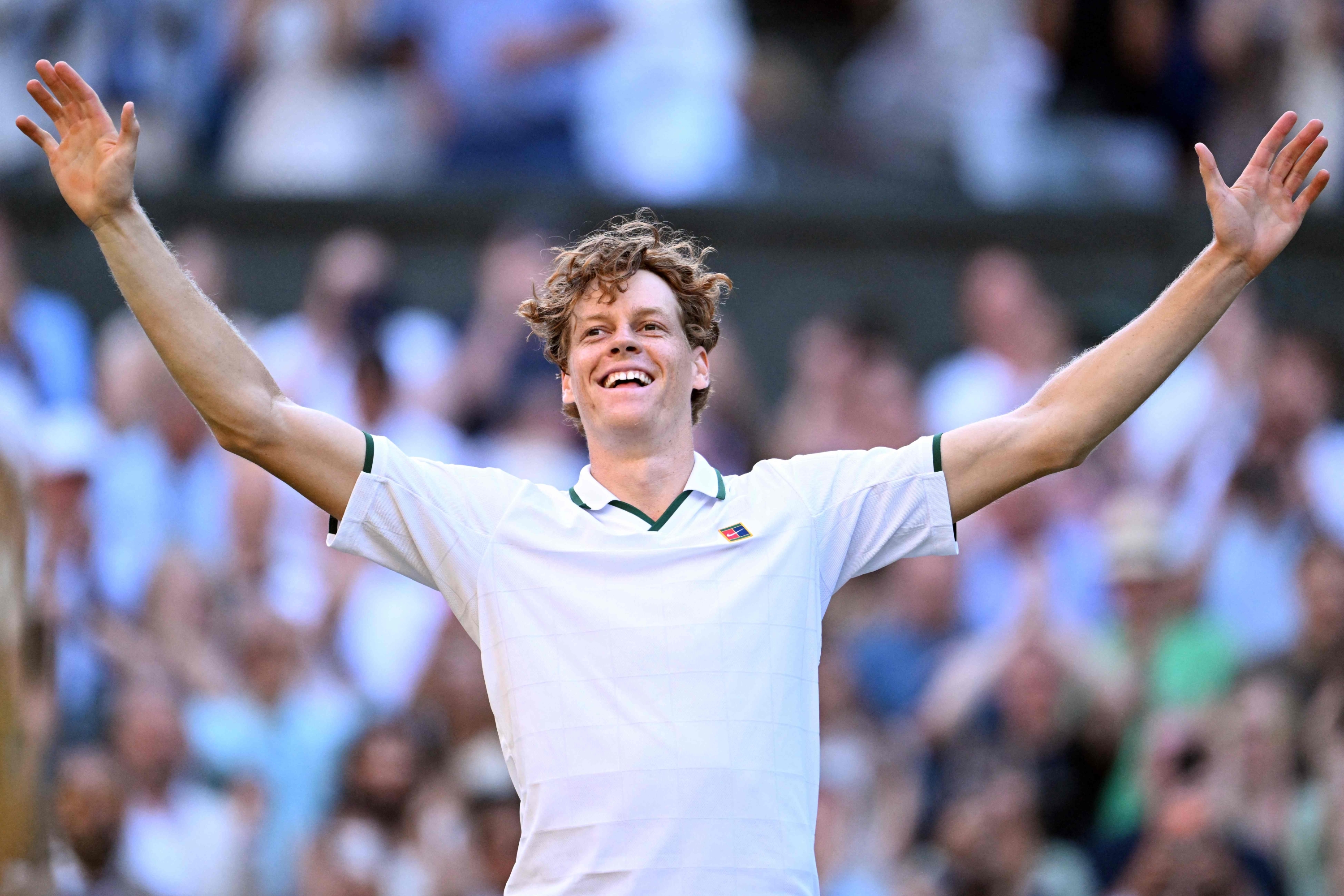 TOPSHOT - Italy's Jannik Sinner reacts to beating Germany's Alexander Zverev during their men's singles final tennis match on the fourteenth day of the 2026 Wimbledon Championships at The All England Lawn Tennis and Croquet Club in Wimbledon, southwest London, on July 12, 2026. (Photo by Kirill KUDRYAVTSEV / AFP) / RESTRICTED TO EDITORIAL USE