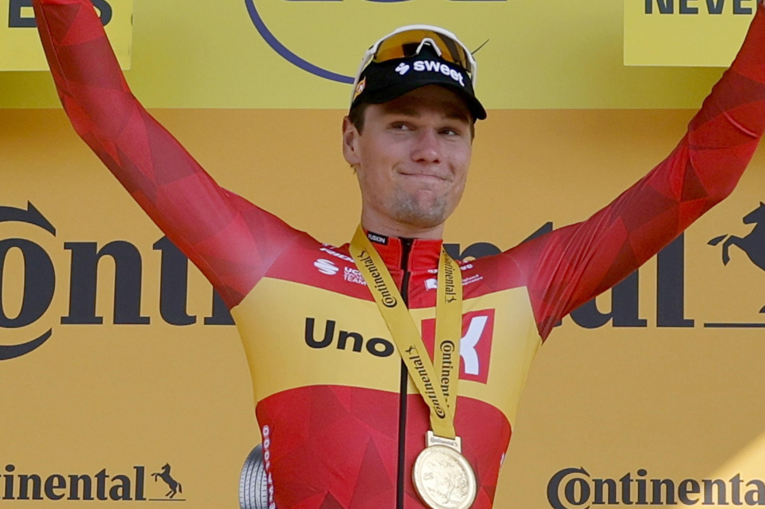 epa13113135 Norwegian cyclist Soren Waerenskjold of Uno-X Mobility celebrates on the podium after winning Stage 11 of the Tour de France, a 161.3 km route from Vichy to Nevers, France, 15 July 2026.  EPA/GUILLAUME HORCAJUELO